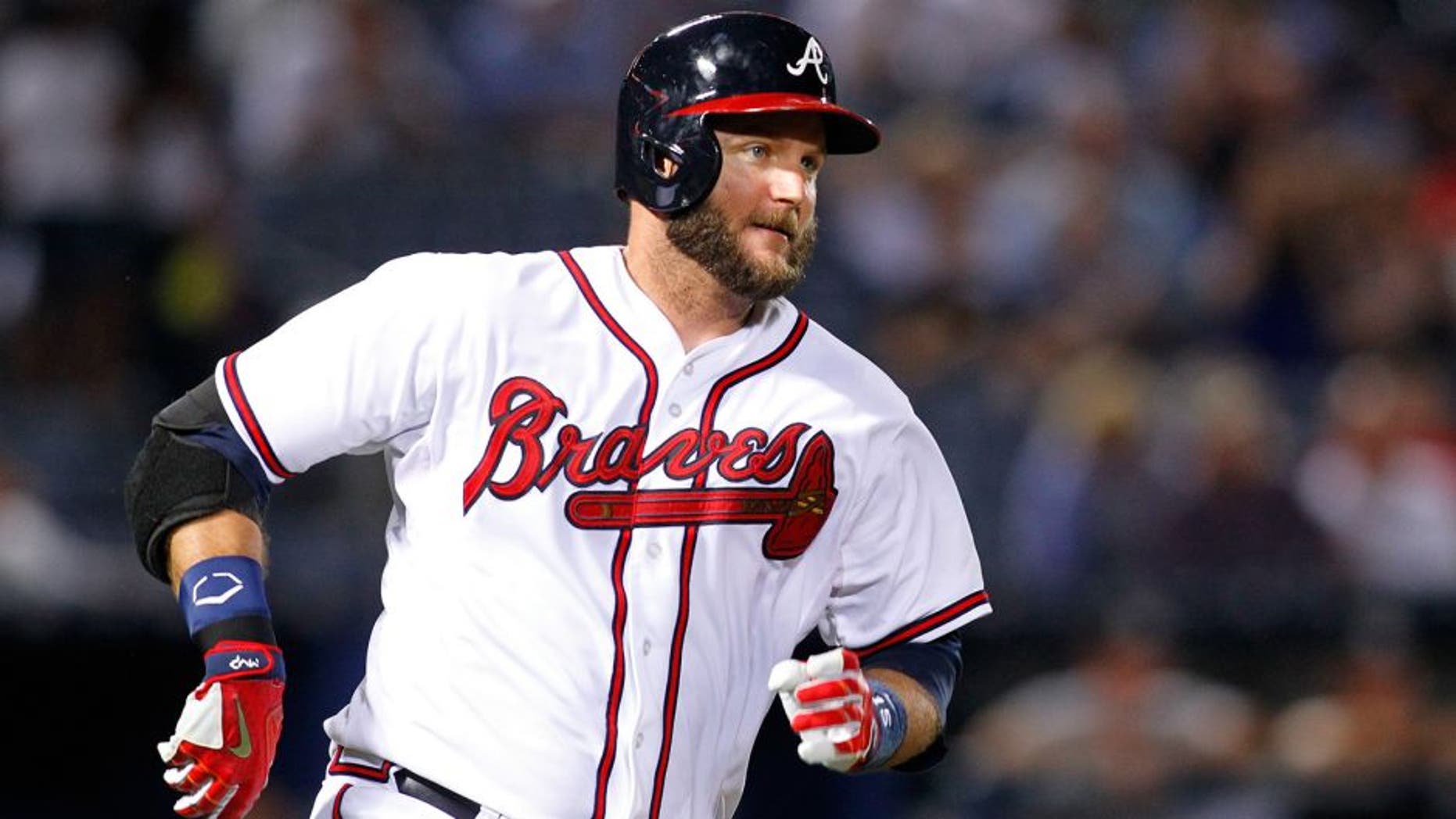 Sep 1, 2015; Atlanta, GA, USA; Atlanta Braves catcher A.J. Pierzynski (15) hits a single against the Miami Marlins in the seventh inning at Turner Field. Mandatory Credit: Brett Davis-USA TODAY Sports