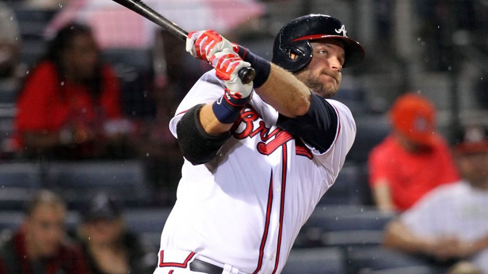 Apr 14, 2015; Atlanta, GA, USA; Atlanta Braves catcher A.J. Pierzynski (15) hits a home run hit against the Miami Marlins in the fourth inning at Turner Field. Mandatory Credit: Brett Davis-USA TODAY Sports