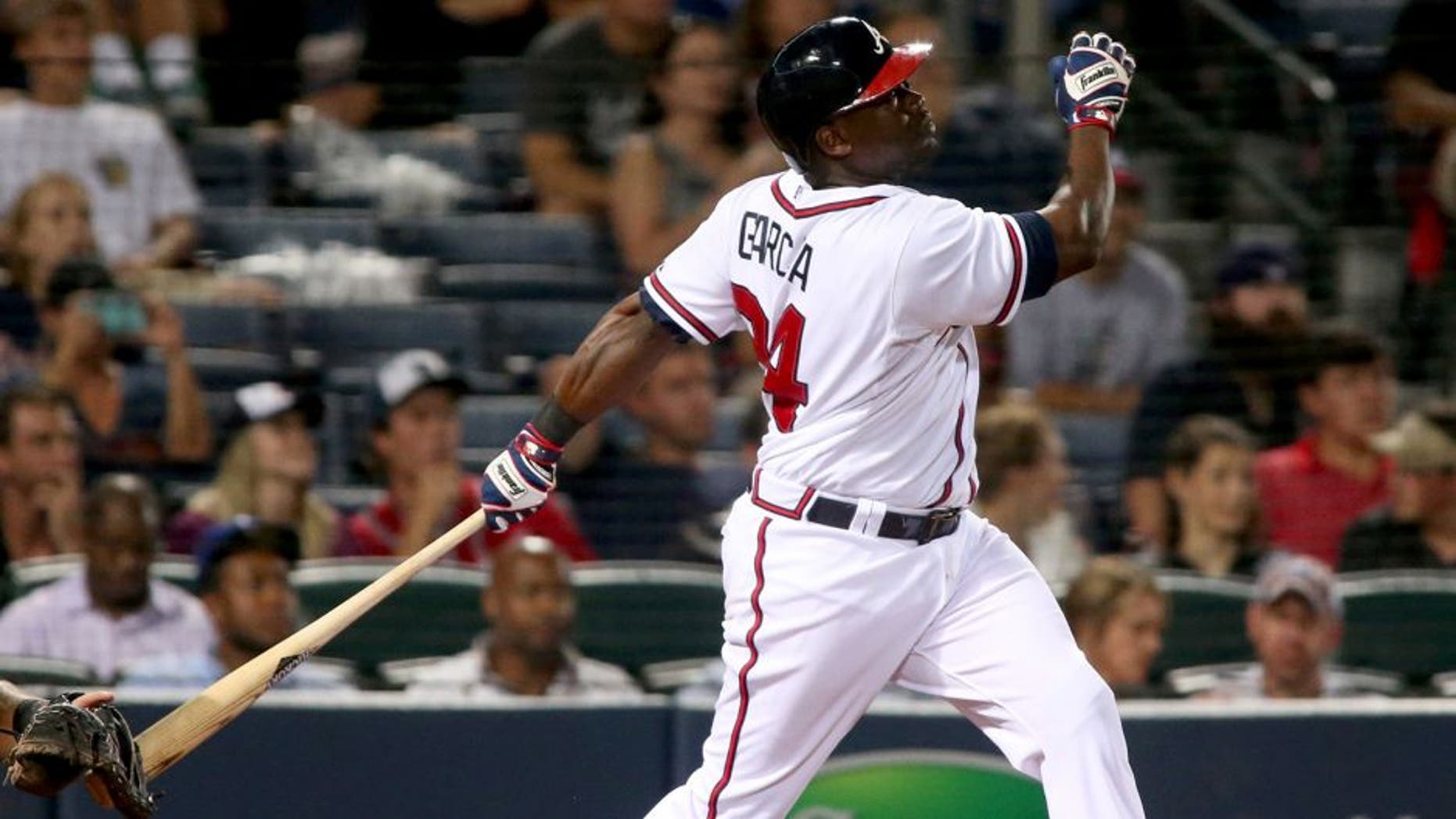 Aug 6, 2015; Atlanta, GA, USA; Atlanta Braves right fielder Adonis Garcia (24) hits a two-run home run in the fifth inning of their game against the Miami Marlins at Turner Field. The Braves won 9-8. Mandatory Credit: Jason Getz-USA TODAY Sports