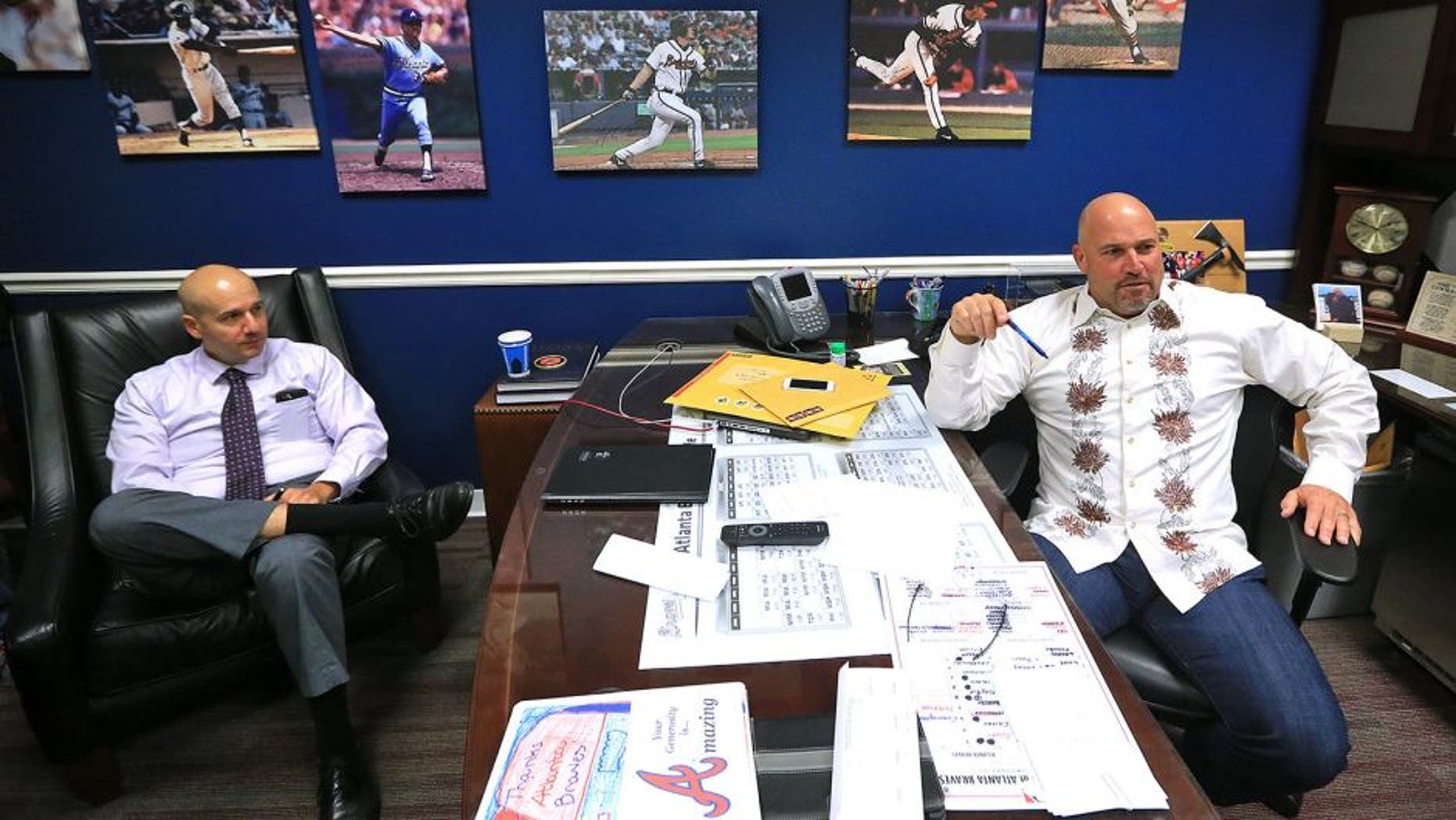 Atlanta Braves manager Fredi Gonzalez, right, and general manager John Coppolella hold end of season interviews Monday, Oct. 5, 2015, in Atlanta. Atlanta finished the season with 67 wins, under 70 wins in a full season for the first time since 1990. (Curtis Compton /Atlanta Journal-Constitution via AP) MARIETTA DAILY OUT; GWINNETT DAILY POST OUT; LOCAL TELEVISION OUT; WXIA-TV OUT; WGCL-TV OUT; MANDATORY CREDIT