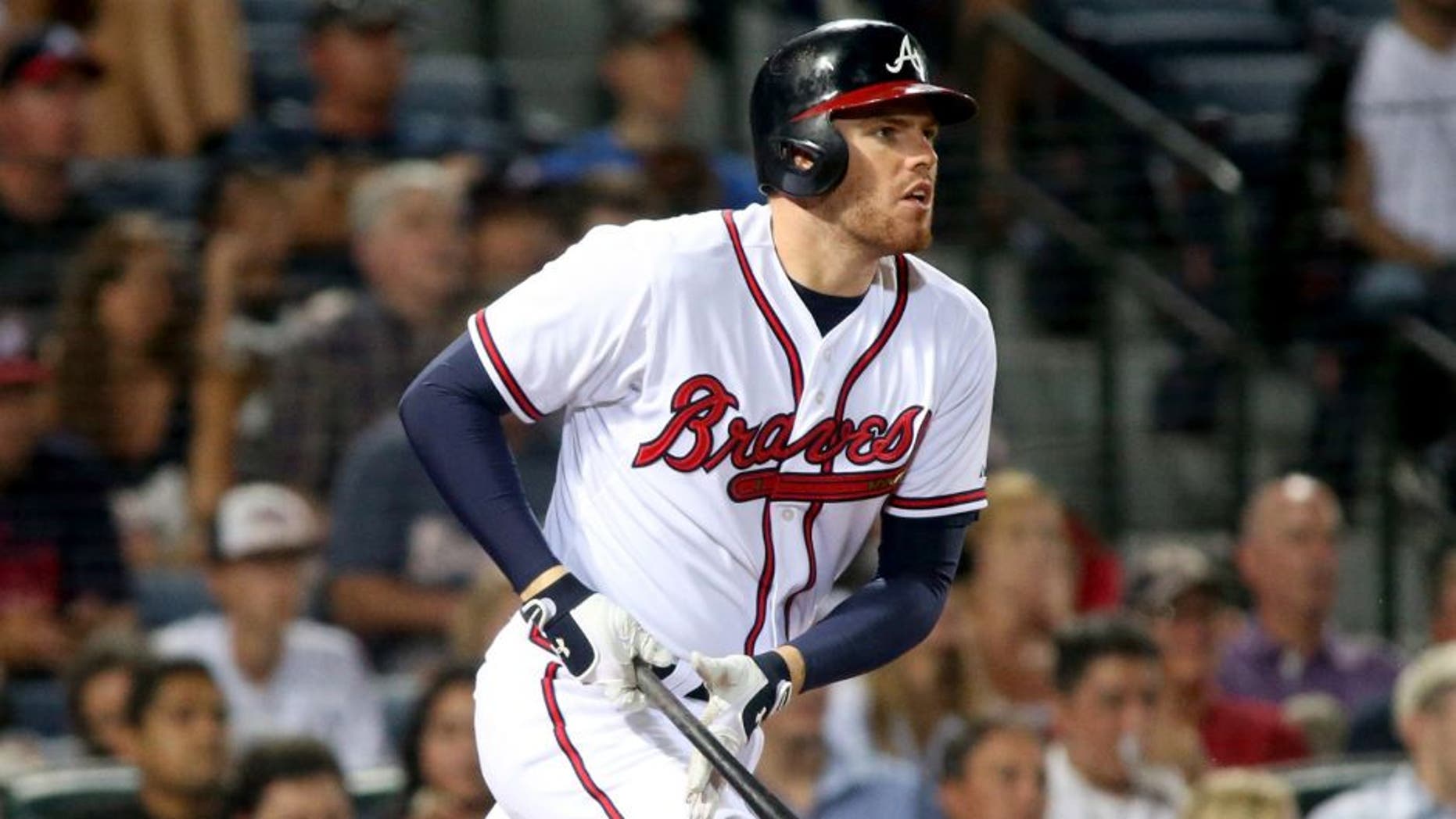 Jun 9, 2015; Atlanta, GA, USA; Atlanta Braves Freddie Freeman (5) hits a single in the sixth inning of their game against the San Diego Padres at Turner Field. Mandatory Credit: Jason Getz-USA TODAY Sports