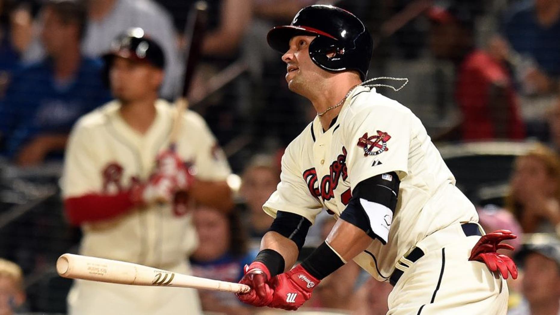 Aug 8, 2015; Atlanta, GA, USA; Atlanta Braves first baseman Nick Swisher (23) drives in two runs with a double against the Miami Marlins during the seventh inning at Turner Field. Mandatory Credit: Dale Zanine-USA TODAY Sports
