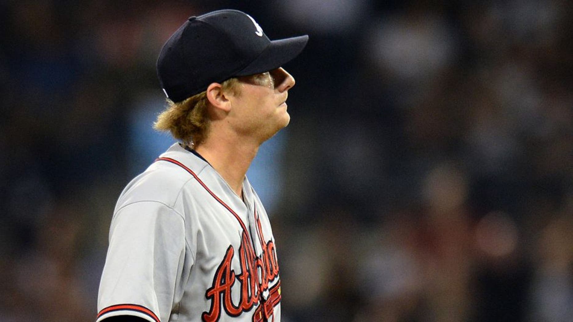 Aug 18, 2015; San Diego, CA, USA; Atlanta Braves relief pitcher Ross Detwiler (56) reacts during the sixth inning against the San Diego Padres at Petco Park. Mandatory Credit: Jake Roth-USA TODAY Sports