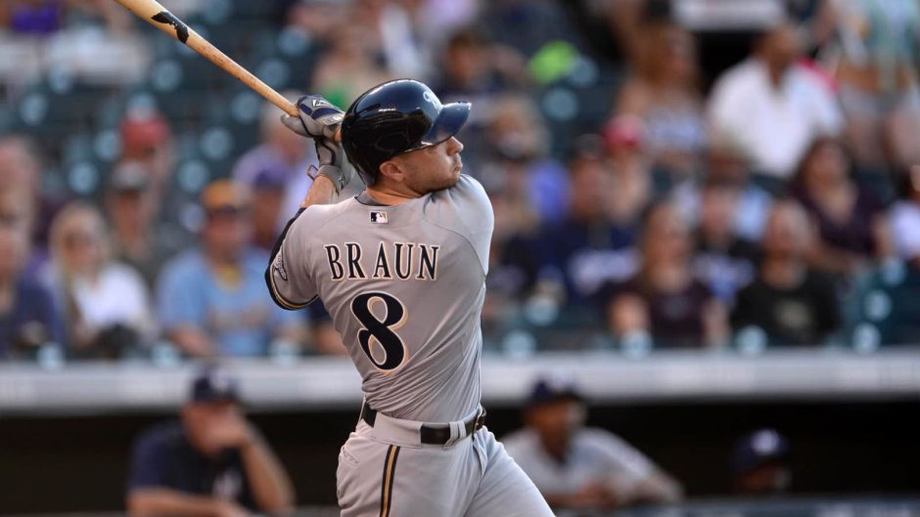 Jun 19, 2015; Denver, CO, USA; Milwaukee Brewers right fielder Ryan Braun hits a two run home run in the fist inning against against the Colorado Rockies at Coors Field.