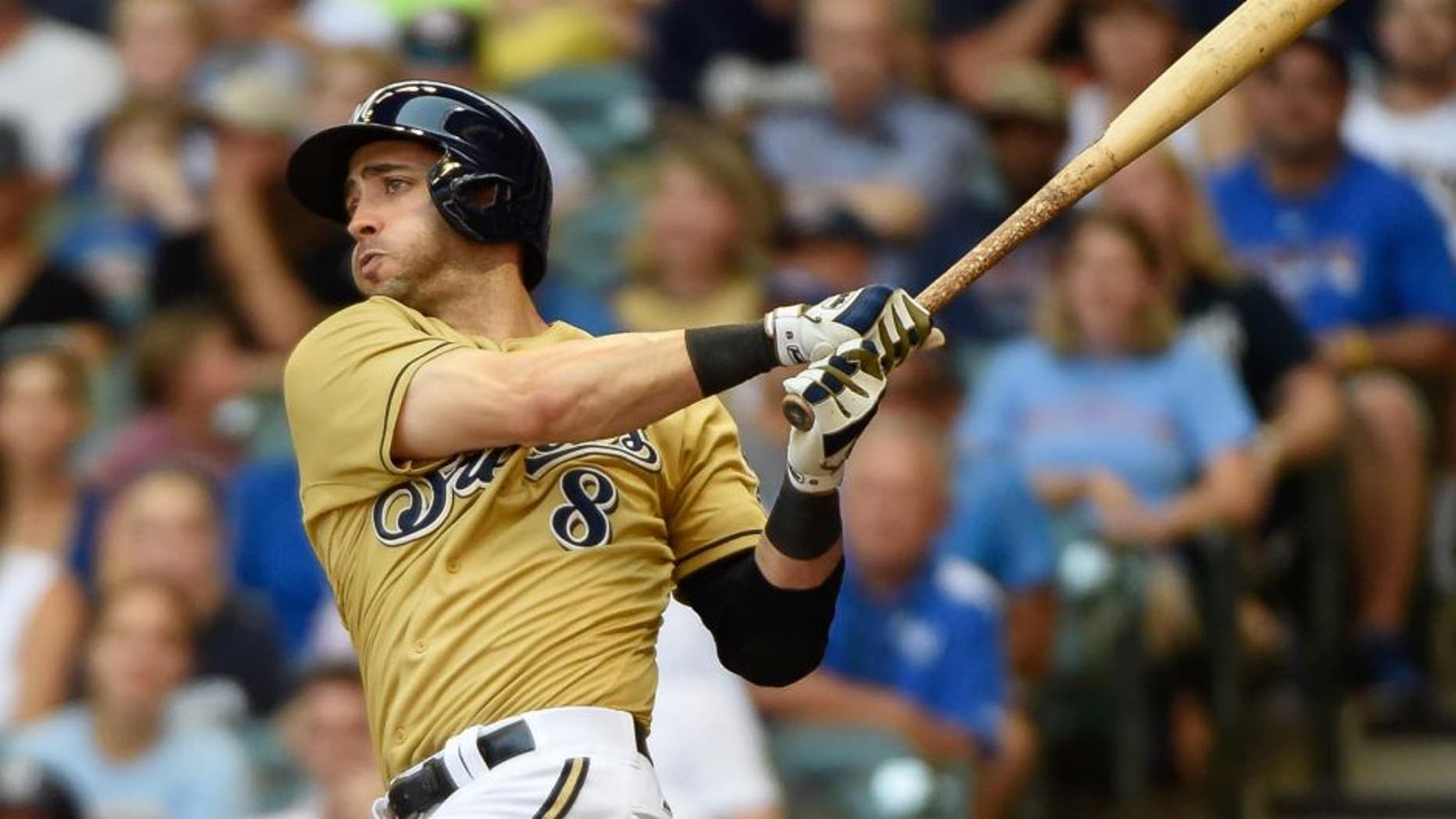 Milwaukee Brewers right fielder Ryan Braun hits a double in the third inning against the Chicago Cubs at Miller Park on Sunday, Aug. 2, 2015.