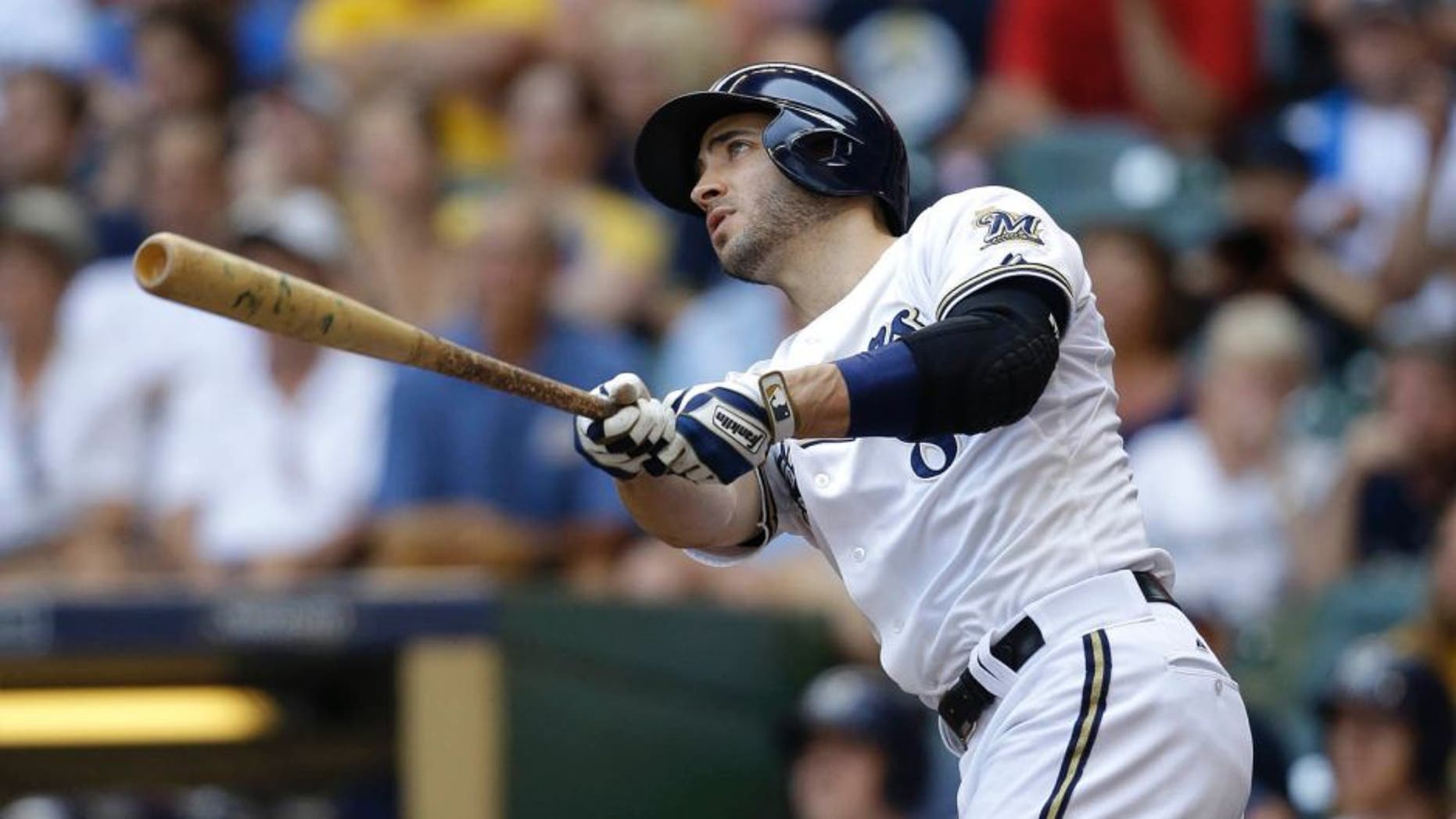 The Milwaukee Brewers' Ryan Braun watches his grand slam against the Philadelphia Phillies during the fifth inning Sunday, Aug. 16, 2015, in Milwaukee.