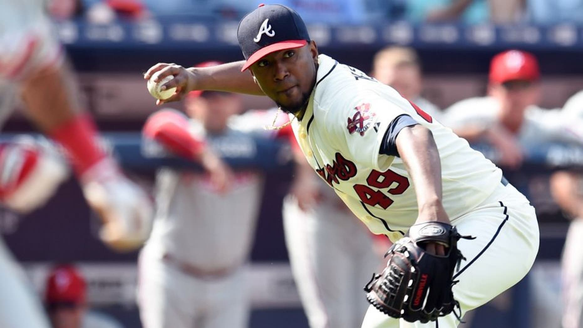Sep 20, 2015; Atlanta, GA, USA; Atlanta Braves starting pitcher Julio Teheran (49) throws out a Philadelphia Phillies batter during the ninth inning at Turner Field. The Braves defeated the Phillies 2-1. Mandatory Credit: Dale Zanine-USA TODAY Sports