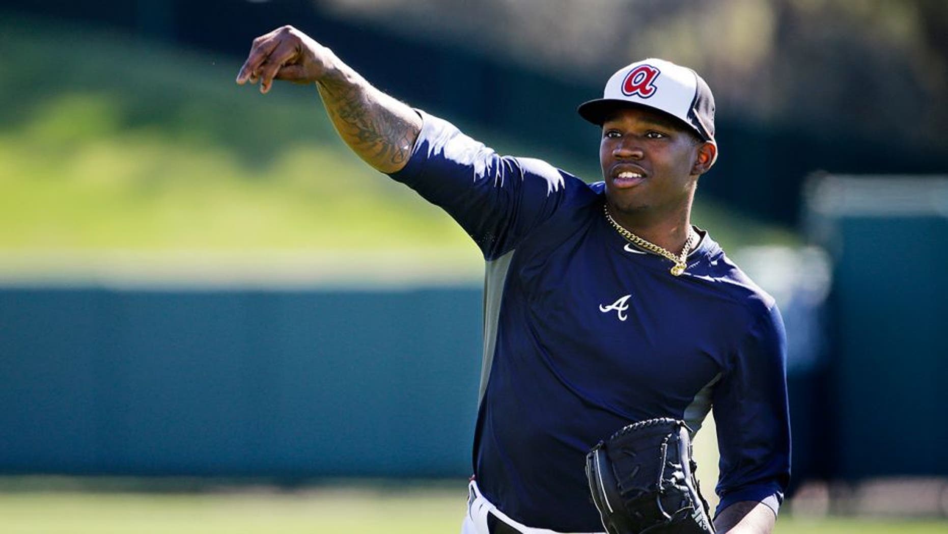 Atlanta Braves' Tyrell Jenkins throws the ball during an informal spring training baseball workout, Friday, Feb. 20, 2015, in Kissimmee, Fla. (AP Photo/David Goldman)