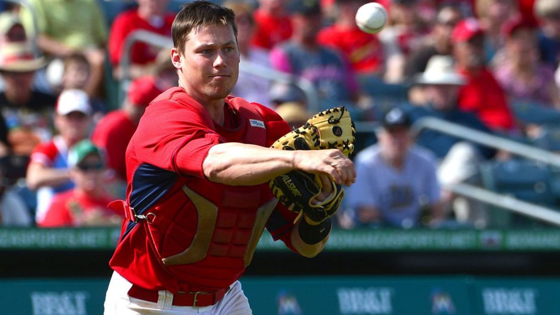 Mar 7, 2014; Jupiter, FL, USA; St. Louis Cardinals catcher Cody Stanley (80) throws out a Miami Marlins base runner at Roger Dean Stadium. The Marlins defeated the Cardinals 7-3. Mandatory Credit: Scott Rovak-USA TODAY Sports