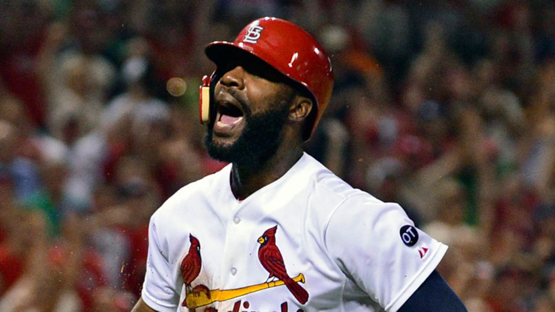 Aug 31, 2015; St. Louis, MO, USA; St. Louis Cardinals center fielder Jason Heyward (22) celebrates after scoring against the Washington Nationals during the seventh inning at Busch Stadium. Mandatory Credit: Jeff Curry-USA TODAY Sports
