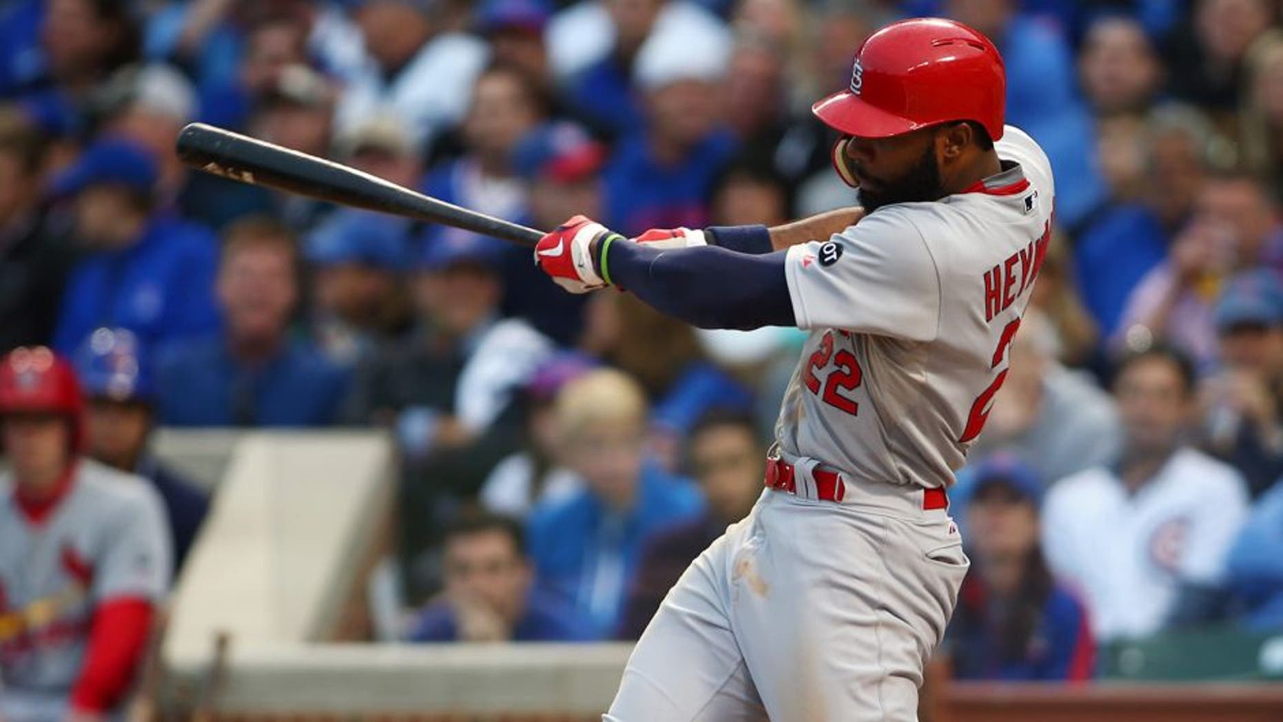 October 13, 2015; Chicago, IL, USA; St. Louis Cardinals right fielder Jason Heyward (22) hits a single in the sixth inning against Chicago Cubs in game four of the NLDS at Wrigley Field. Mandatory Credit: Jerry Lai-USA TODAY Sports