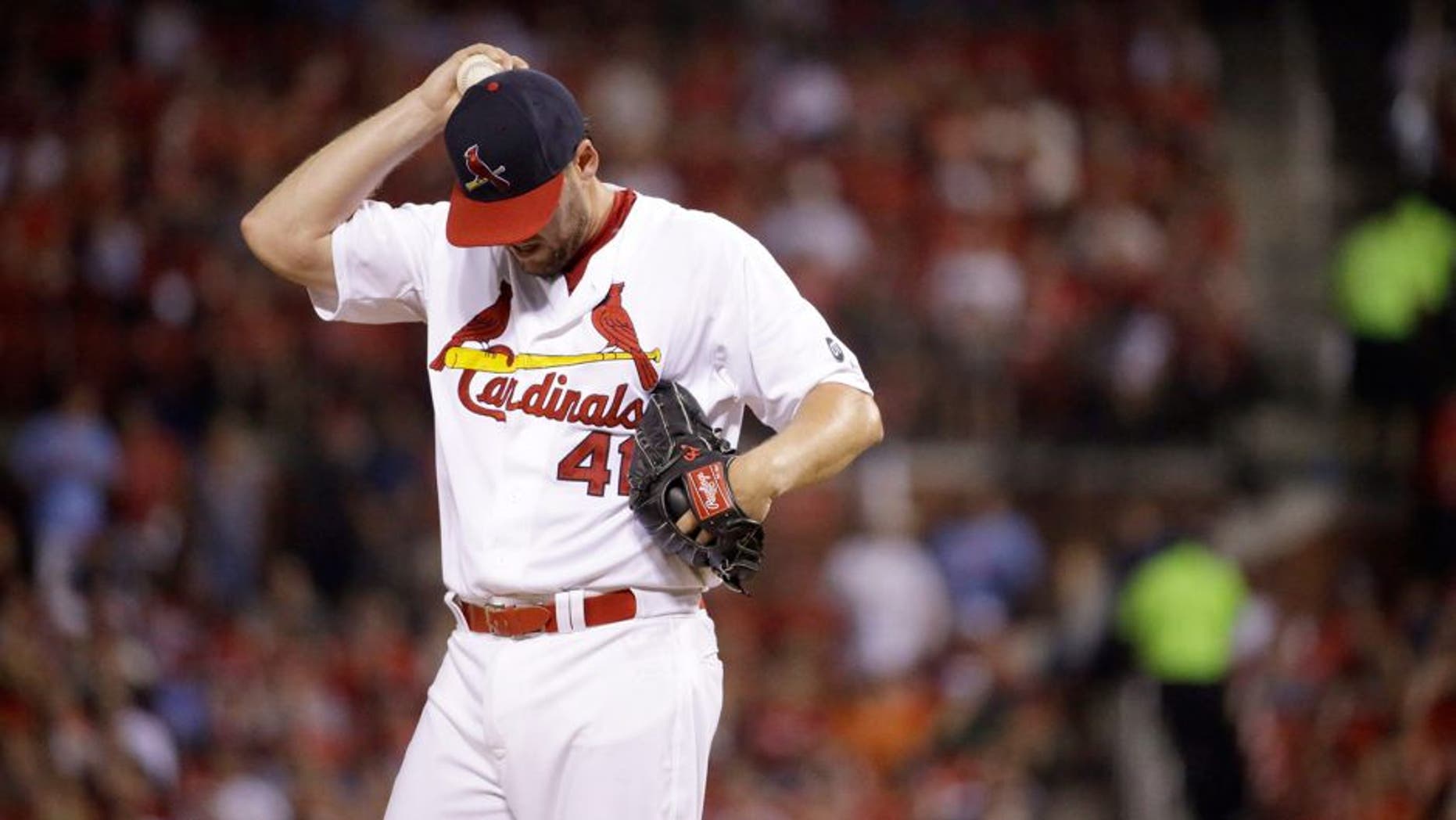St. Louis Cardinals starting pitcher John Lackey pauses on the mound during the fifth inning of a baseball game against the Pittsburgh Pirates, Sunday, Sept. 6, 2015, in St. Louis. (AP Photo/Jeff Roberson)