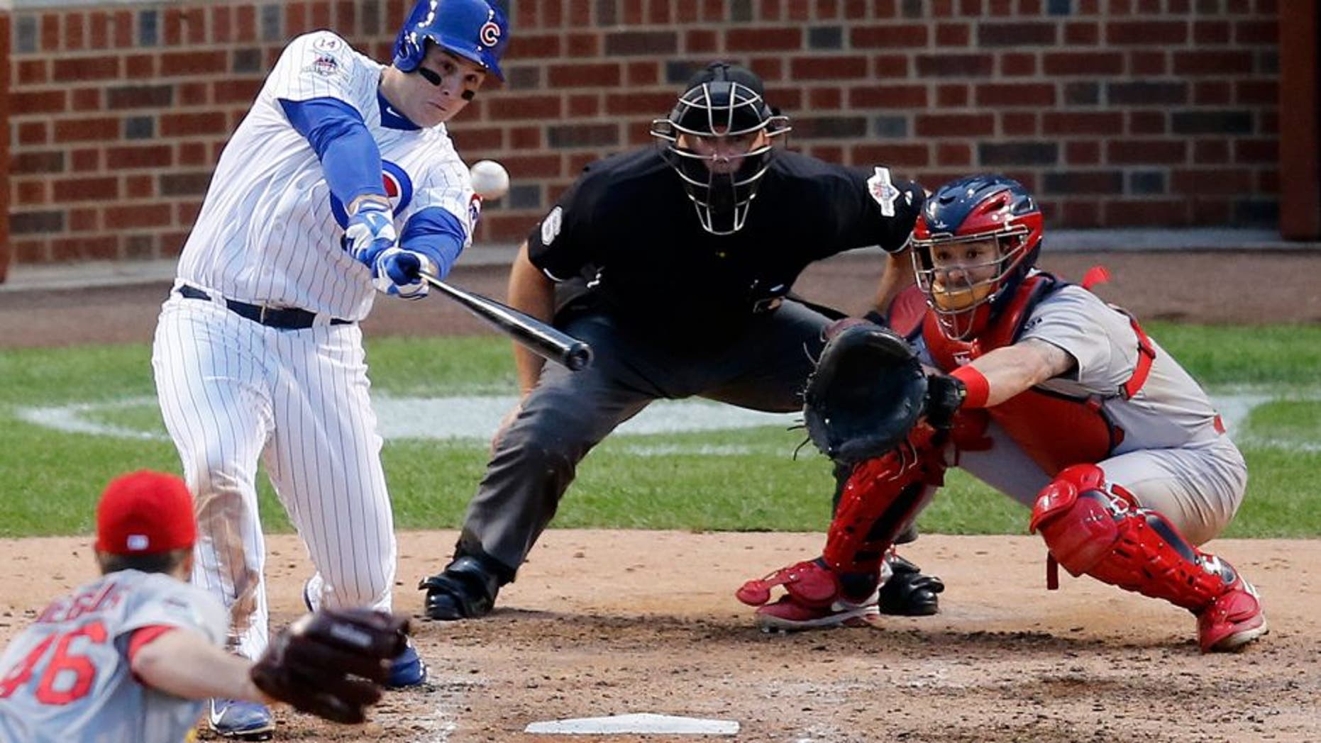 Chicago Cubs' Anthony Rizzo (44) hits a home run against the St. Louis Cardinals during the sixth inning of Game 4 in baseball's National League Division Series, Tuesday, Oct. 13, 2015, in Chicago. (AP Photo/Charles Rex Arbogast)