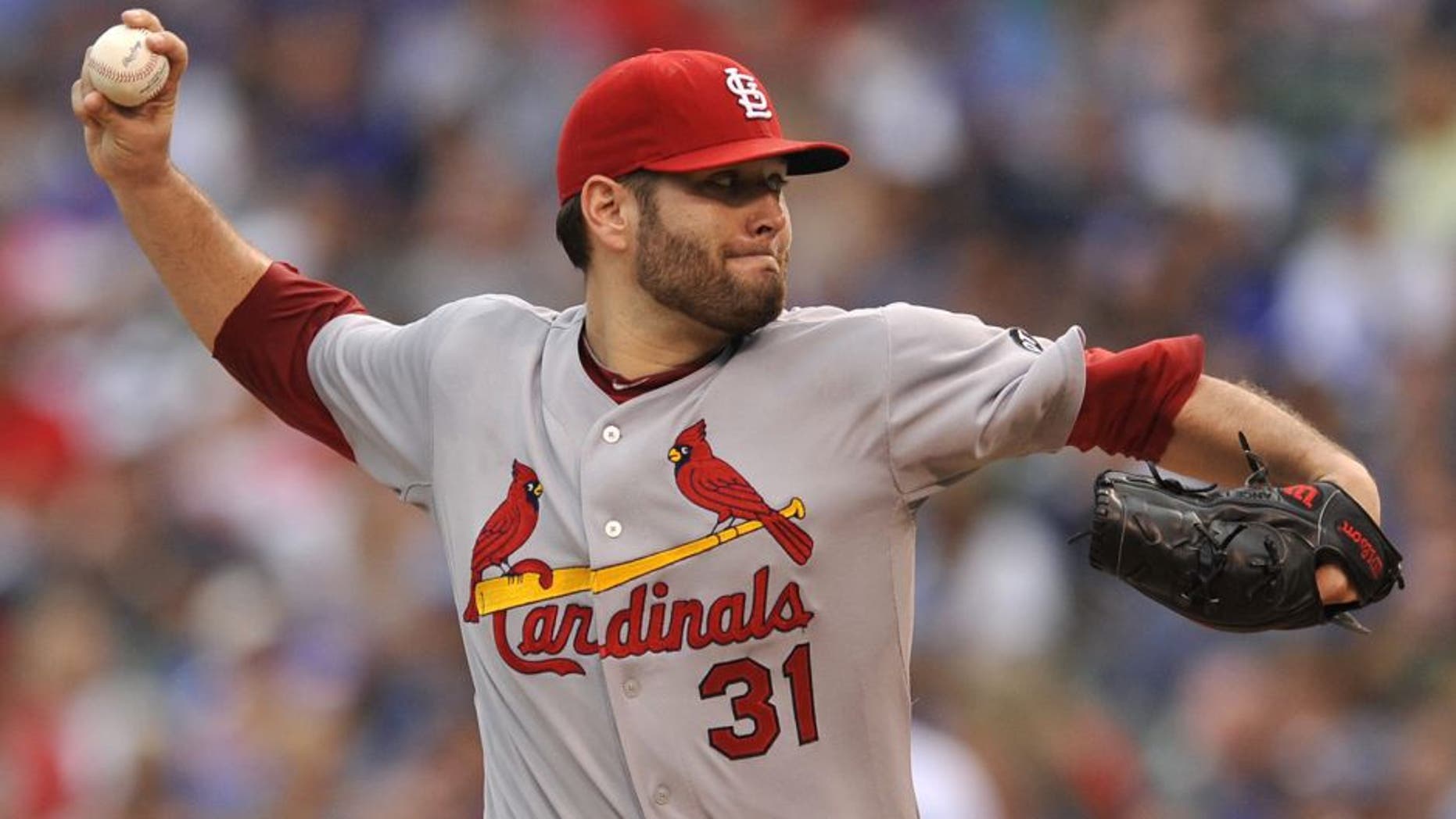 St. Louis Cardinals starter Lance Lynn delivers a pitch during the first inning of a baseball game against the Chicago Cubs, Friday, Sept. 18, 2015, in Chicago. (AP Photo/Paul Beaty)