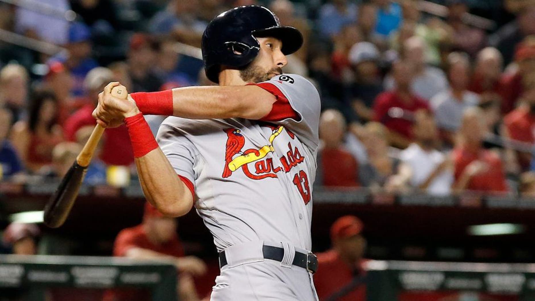 St. Louis Cardinals' Matt Carpenter watches an RBI single against the Arizona Diamondbacks during the seventh inning of a baseball game Wednesday, Aug. 26, 2015, in Phoenix. (AP Photo/Ross D. Franklin)
