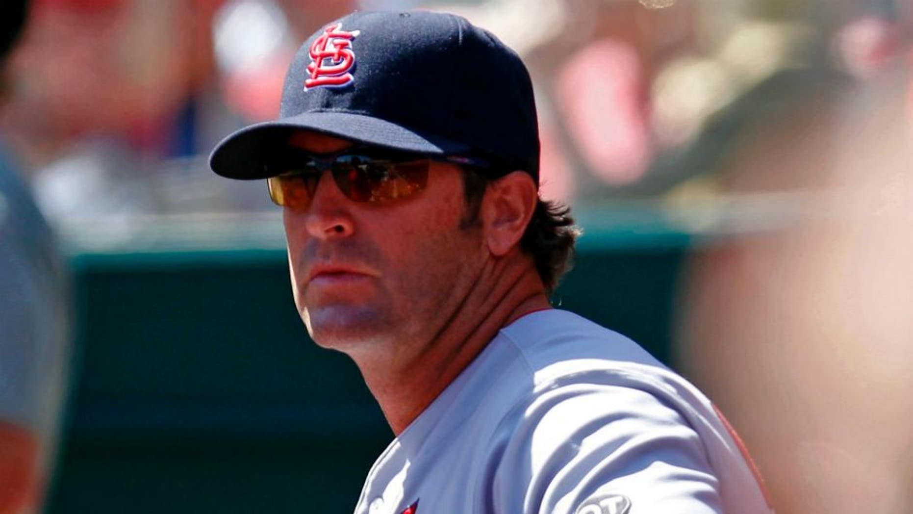 Apr 11, 2015; Cincinnati, OH, USA; St. Louis Cardinals manager Mike Matheny (26) in the dug out during the ninth inning against the Cincinnati Reds at Great American Ball Park. The Cardinals won 4-1. Mandatory Credit: Frank Victores-USA TODAY Sports