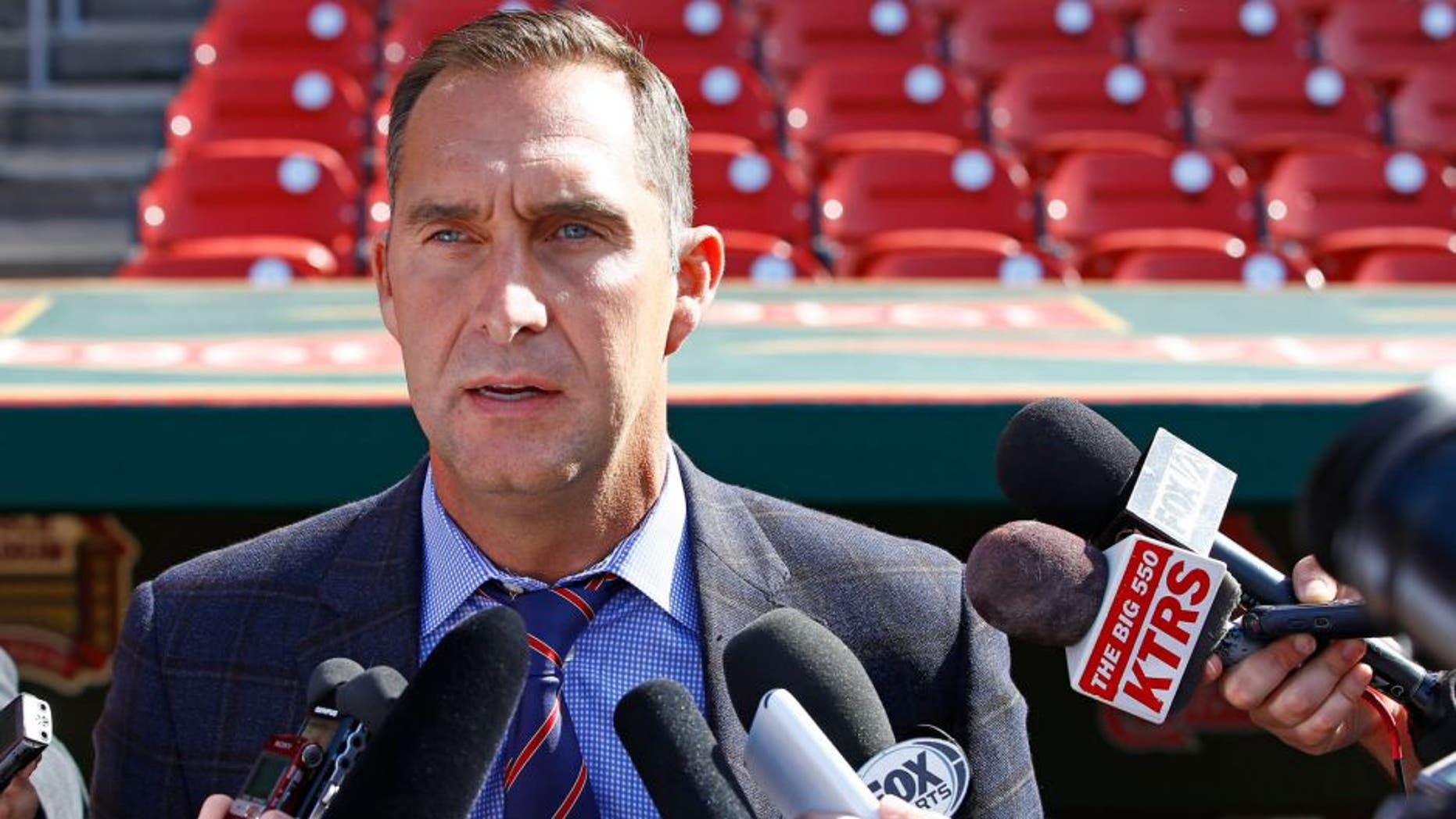 St. Louis Cardinals General Manager John Mozeliak addresses members of the media regarding the condition of Adam Wainwright, prior to a baseball game against the Philadelphia Phillies, Monday, April 27, 2015, in St. Louis. Mozeliak confirmed Wainwright has a torn Achilles and will require season ending surgery. (AP Photo/Billy Hurst)