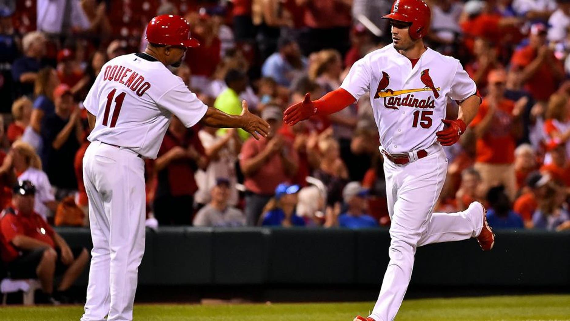 Sep 8, 2015; St. Louis, MO, USA; St. Louis Cardinals left fielder Randal Grichuk (15) celebrates with St. Louis Cardinals third base coach Jose Oquendo (11) after hitting a two-run home run against the St. Louis Cardinals at Busch Stadium. Mandatory Credit: Jasen Vinlove-USA TODAY Sports