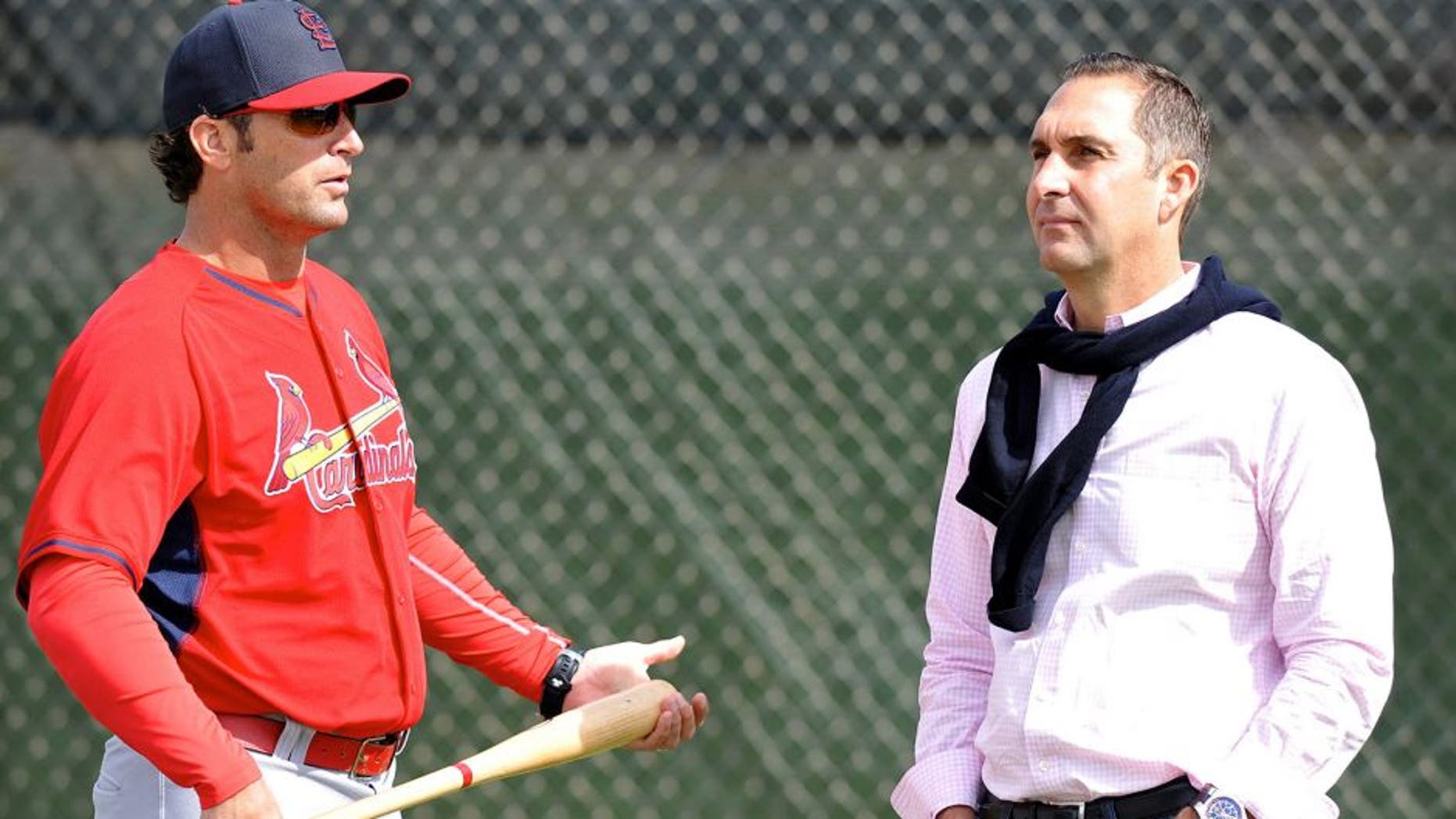 Feb 21, 2015; Jupiter, FL, USA; St. Louis Cardinals manager Mike Matheny (left) talks with Cardinals general manager John Mozeliak (right) during practice drills at Roger Dean Stadium. Mandatory Credit: Steve Mitchell-USA TODAY Sports