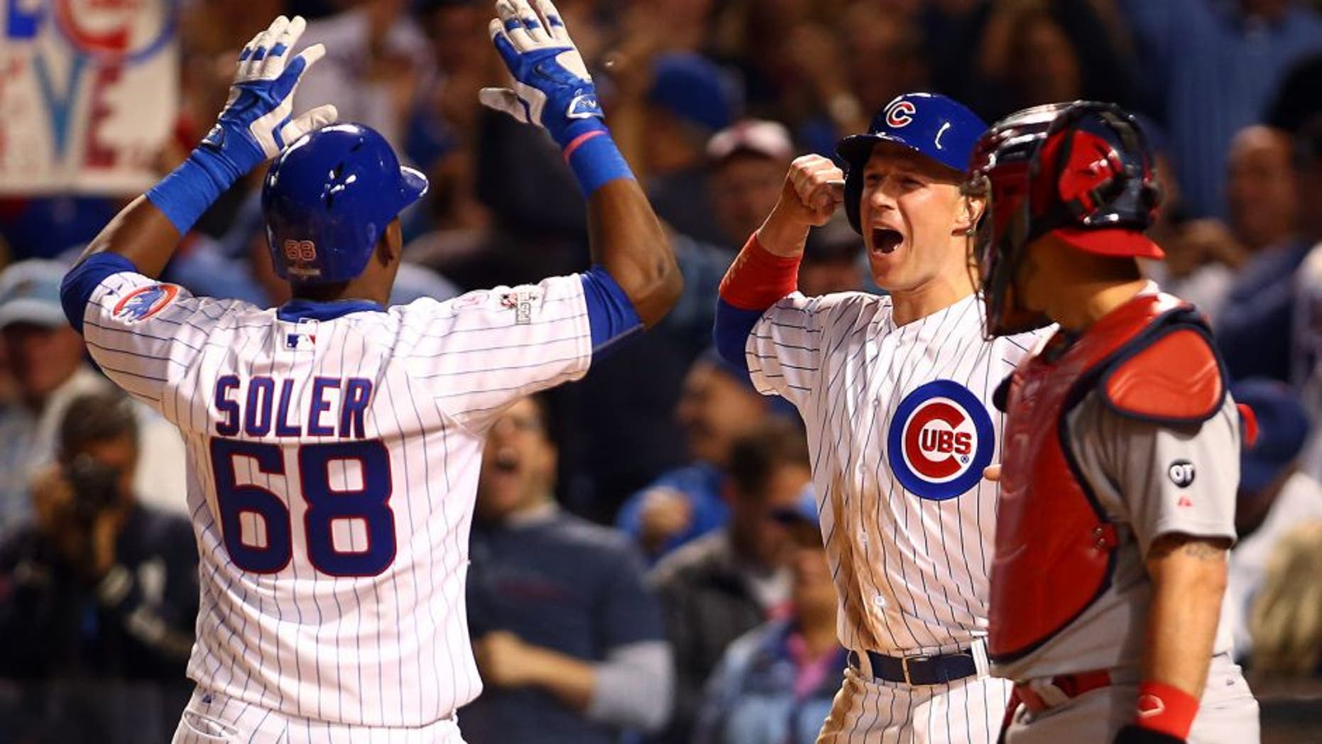 Oct 12, 2015; Chicago, IL, USA; Chicago Cubs right fielder Jorge Soler (68) celebrates with left fielder Chris Coghlan (8) after hitting a two run home run during the sixth inning against the St. Louis Cardinals in game three of the NLDS at Wrigley Field. Mandatory Credit: Jerry Lai-USA TODAY Sports