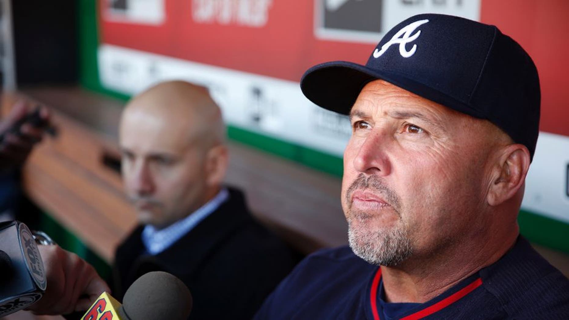 FILE - In this April 13, 2016, file photo, Atlanta Braves manager Fredi Gonzalez, right, with general manager John Coppolella sitting at left, talks with the media before a baseball game against the Washington Nationals at Nationals Park, in Washington. The Atlanta Braves have fired manager Fredi Gonzalez, who couldnât survive the worst record in the majors. Braves general manager John Coppolella confirmed the firing of Gonzalez, in his sixth season, Tuesday, May 17, 2016. (AP Photo/Alex Brandon, File)