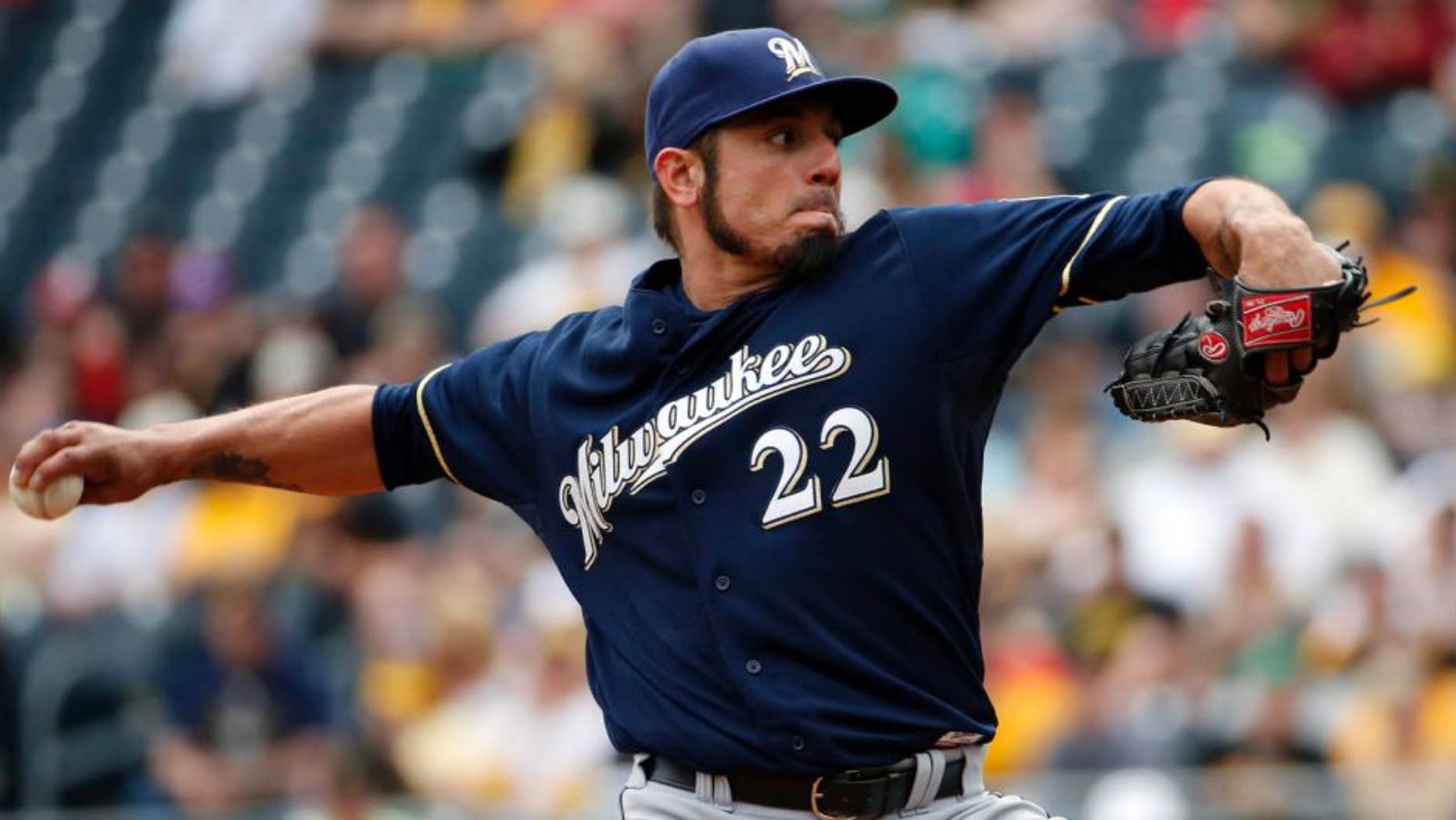 Milwaukee Brewers starting pitcher Matt Garza throws in the first inning against the Pittsburgh Pirates in Pittsburgh, Sunday, April 19, 2015.