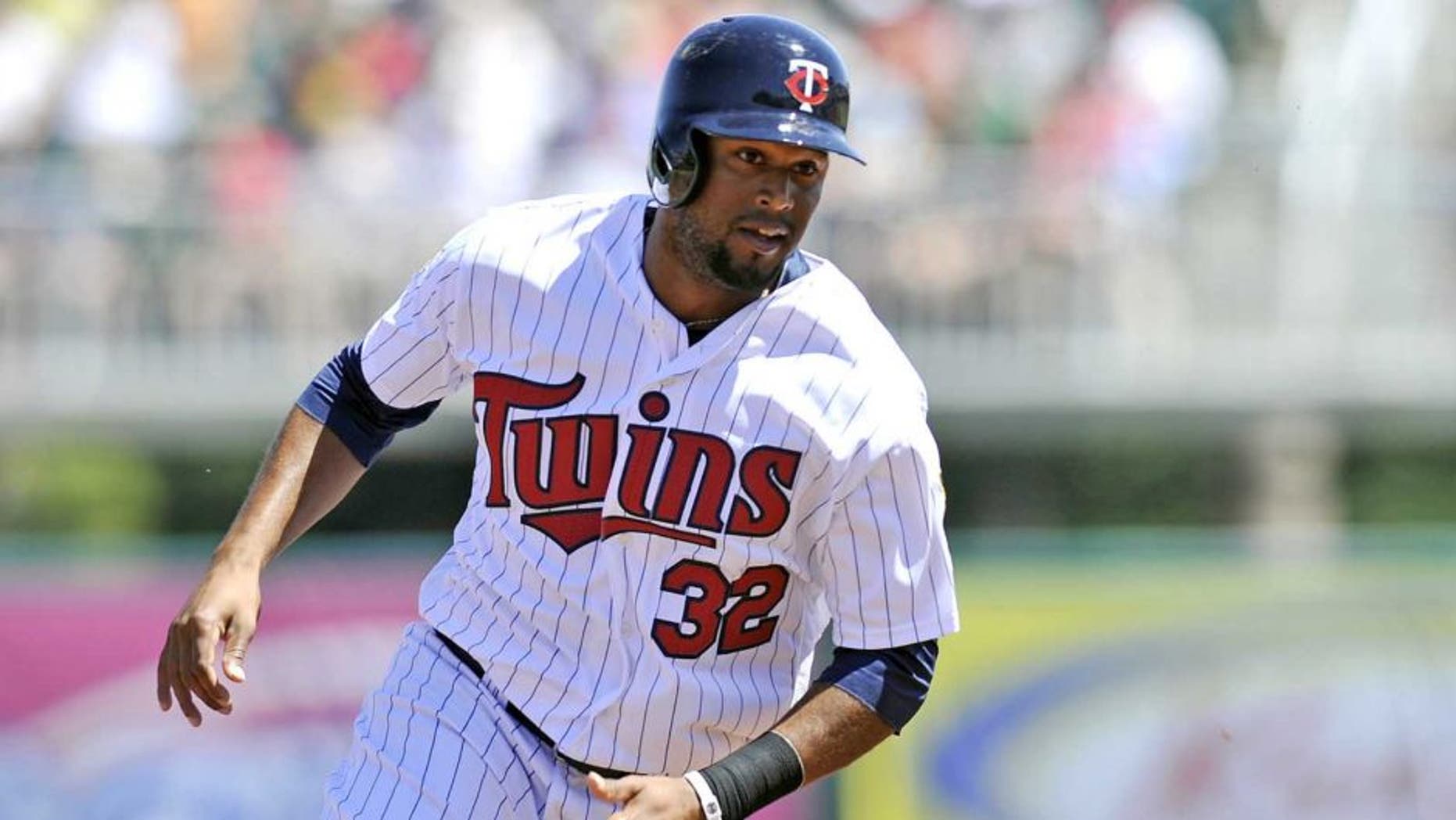 March 13, 2014: Minnesota Twins center fielder Aaron Hicks rounds third base during a game against the Boston Red Sox at Hammond Stadium.