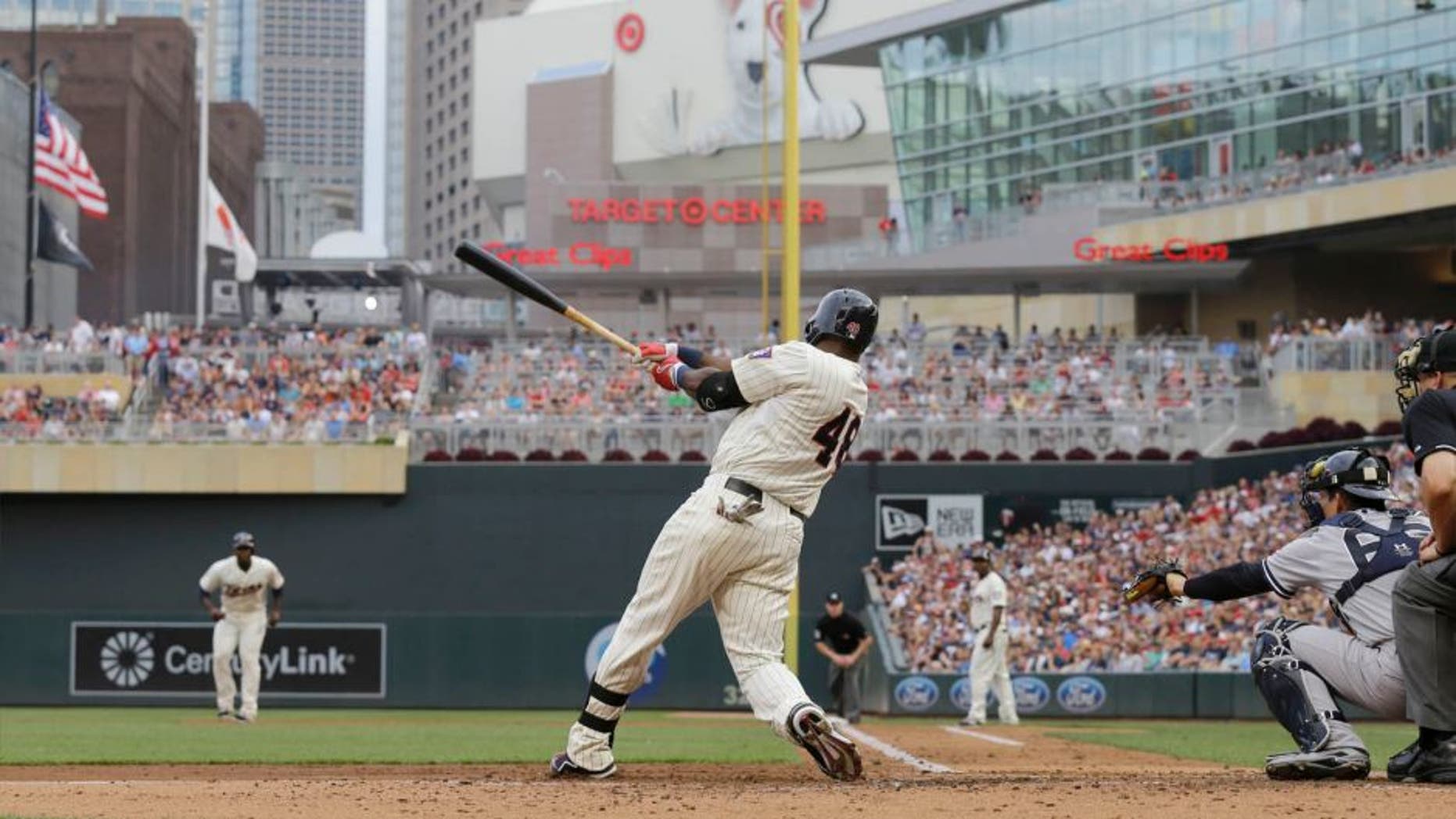 The Minnesota Twins' Torii Hunter hits a three-run home run off New York Yankees starting pitcher CC Sabathia during the third inning in Minneapolis, Saturday, July 25, 2015.