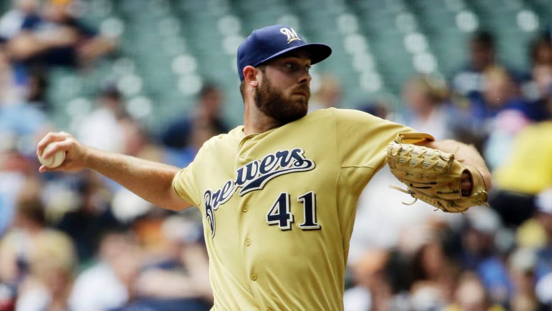 Milwaukee Brewers starting pitcher Taylor Jungmann throws during the first inning against the Washington Nationals, Sunday, June 14, 2015, in Milwaukee.