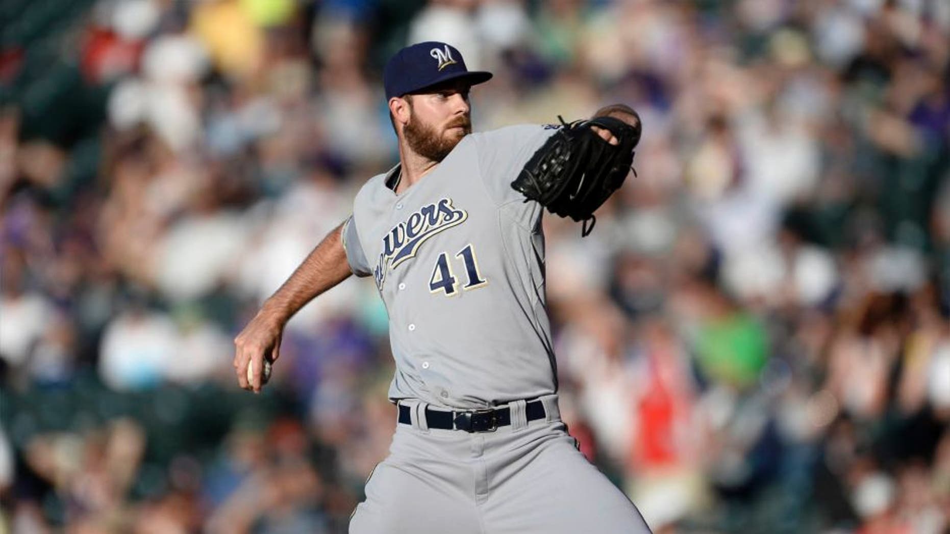 Jun 19, 2015; Denver, CO, USA; Milwaukee Brewers starting pitcher Taylor Jungmann delivers a pitch in the first inning against the Colorado Rockies at Coors Field.