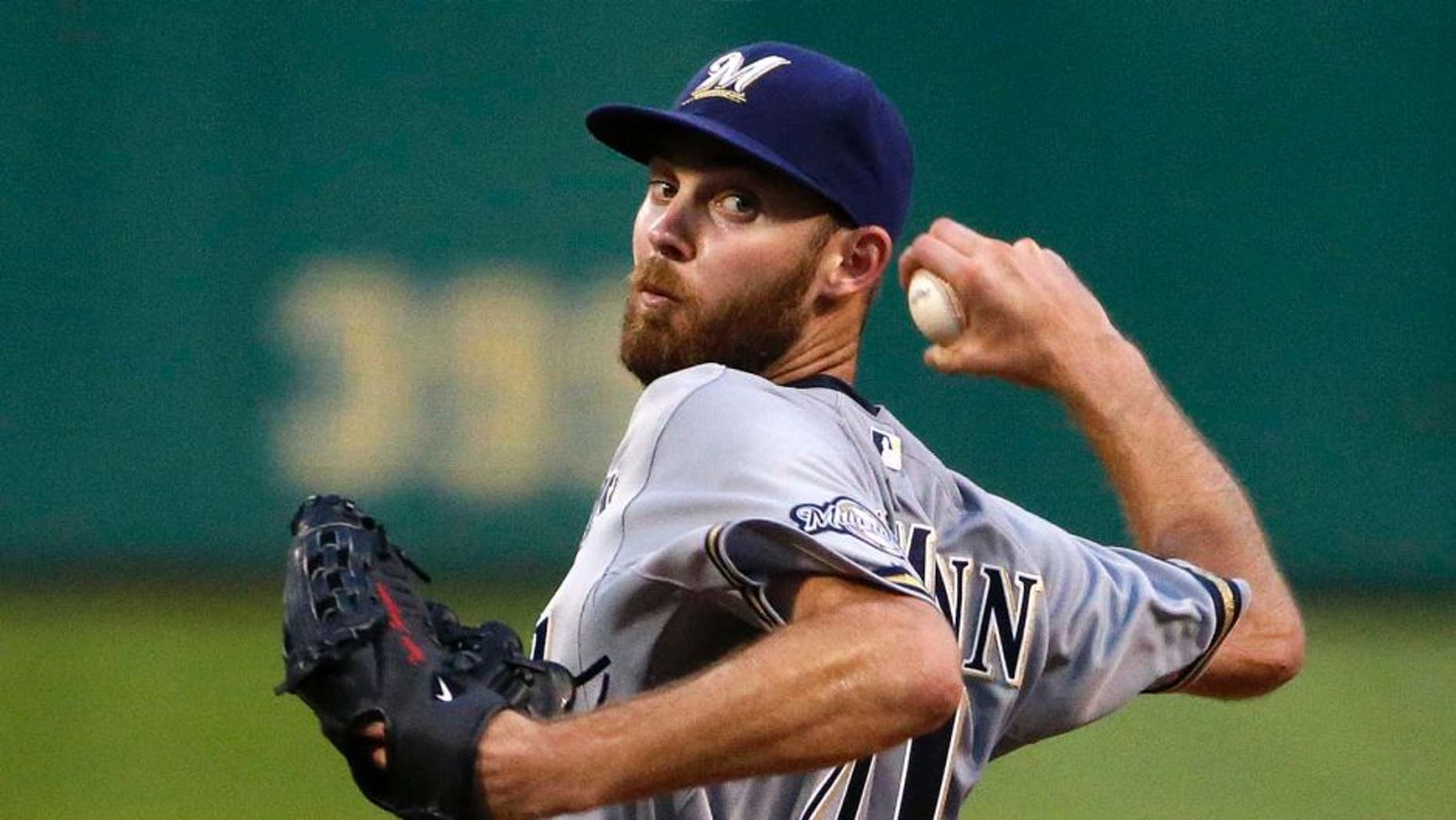 Milwaukee Brewers starting pitcher Taylor Jungmann delivers in the seventh inning of his first major league start during a baseball game against the Pittsburgh Pirates in Pittsburgh, Tuesday, June 9, 2015.