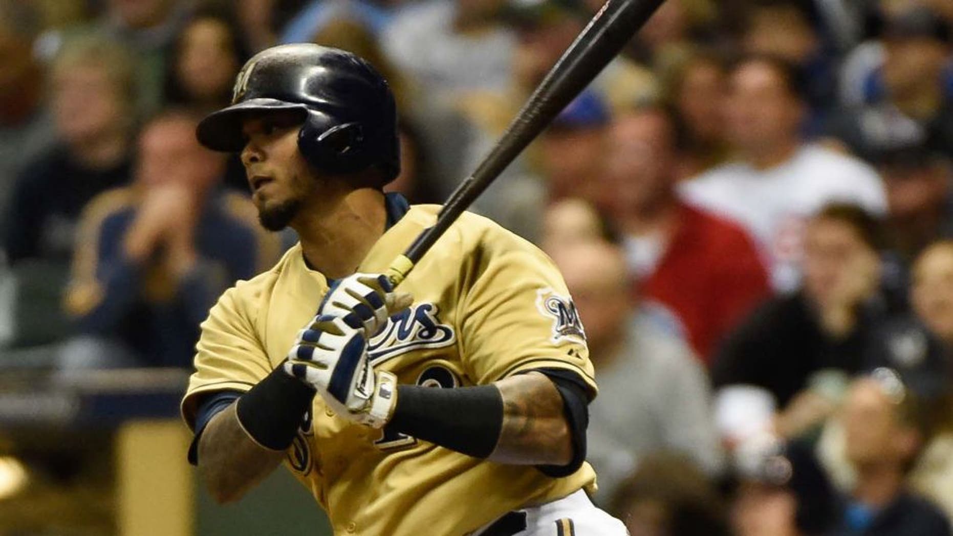 Milwaukee Brewers catcher Martin Maldonado hits a single in the sixth inning against the Chicago Cubs at Miller Park on Saturday, Oct. 3, 2015.