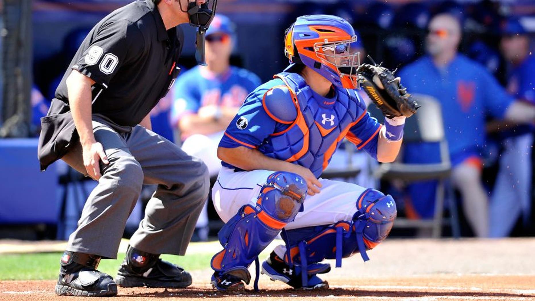 Feb 28, 2014; Port St. Lucie, FL, USA; New York Mets catcher Travis d'Arnaud (15) catches a pitch against the Washington Nationals in spring training action at Tradition Stadium. Mandatory Credit: Brad Barr-USA TODAY Sports