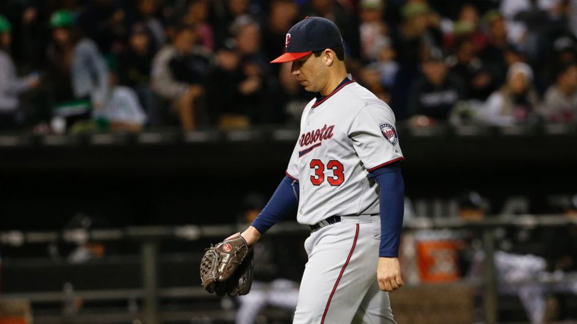 Minnesota Twins starting pitcher Tommy Milone leaves the baseball game against the Chicago White Sox in the fourth inning at U.S Cellular Field in Chicago on Saturday, Sept. 12, 2015.
