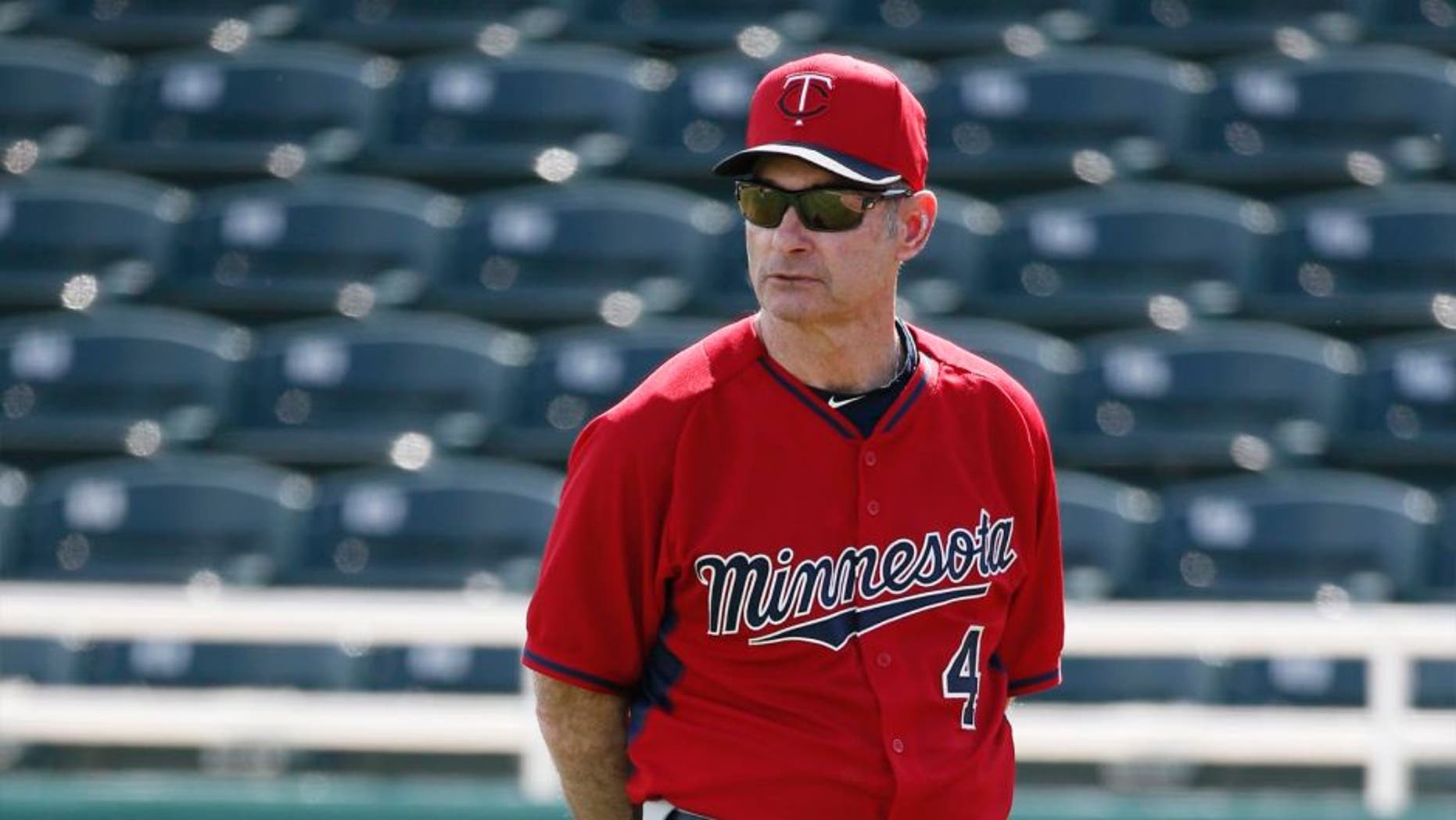 Minnesota Twins manager Paul Molitor watches as catchers run through drills at baseball spring training in Fort Myers, Fla. on Tuesday Feb. 24, 2015.