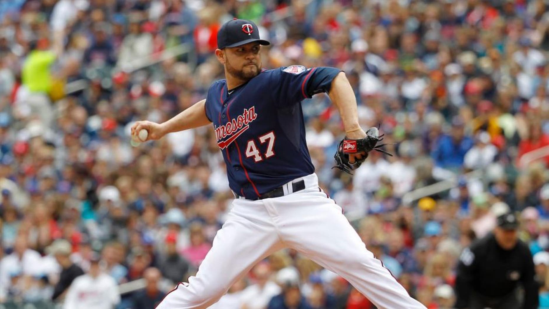Minnesota Twins starting pitcher Ricky Nolasco delivers to the Toronto Blue Jays during the first inning in Minneapolis, Sunday, May 31, 2015.