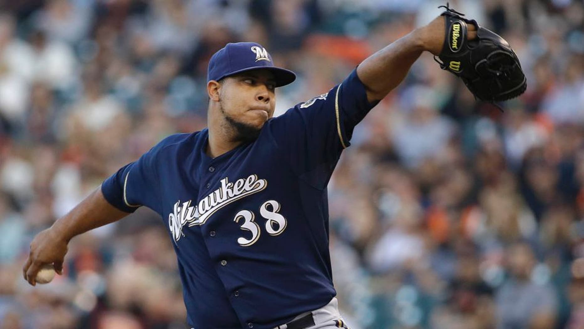 Milwaukee Brewers pitcher Wily Peralta throws against the San Francisco Giants during the first inning in San Francisco, Tuesday, July 28, 2015.