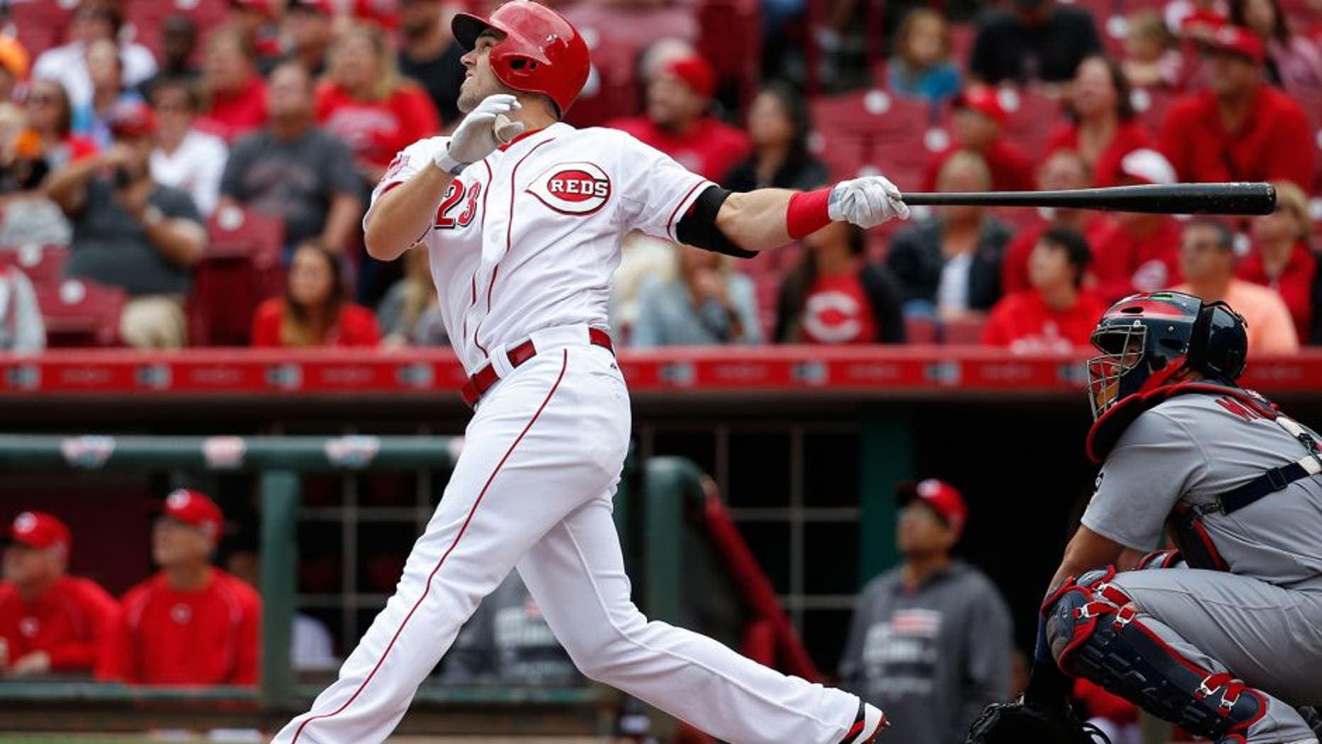Cincinnati Reds' Adam Duvall hits the game winning two-run home run off St. Louis Cardinals relief pitcher Jonathan Broxton in the eighth inning of a resumed baseball game, Saturday, Sept. 12, 2015, in Cincinnati. The game was resumed in the top of the eighth inning after it was suspended the day before due to rain. The Reds won 4-2. (AP Photo/John Minchillo)