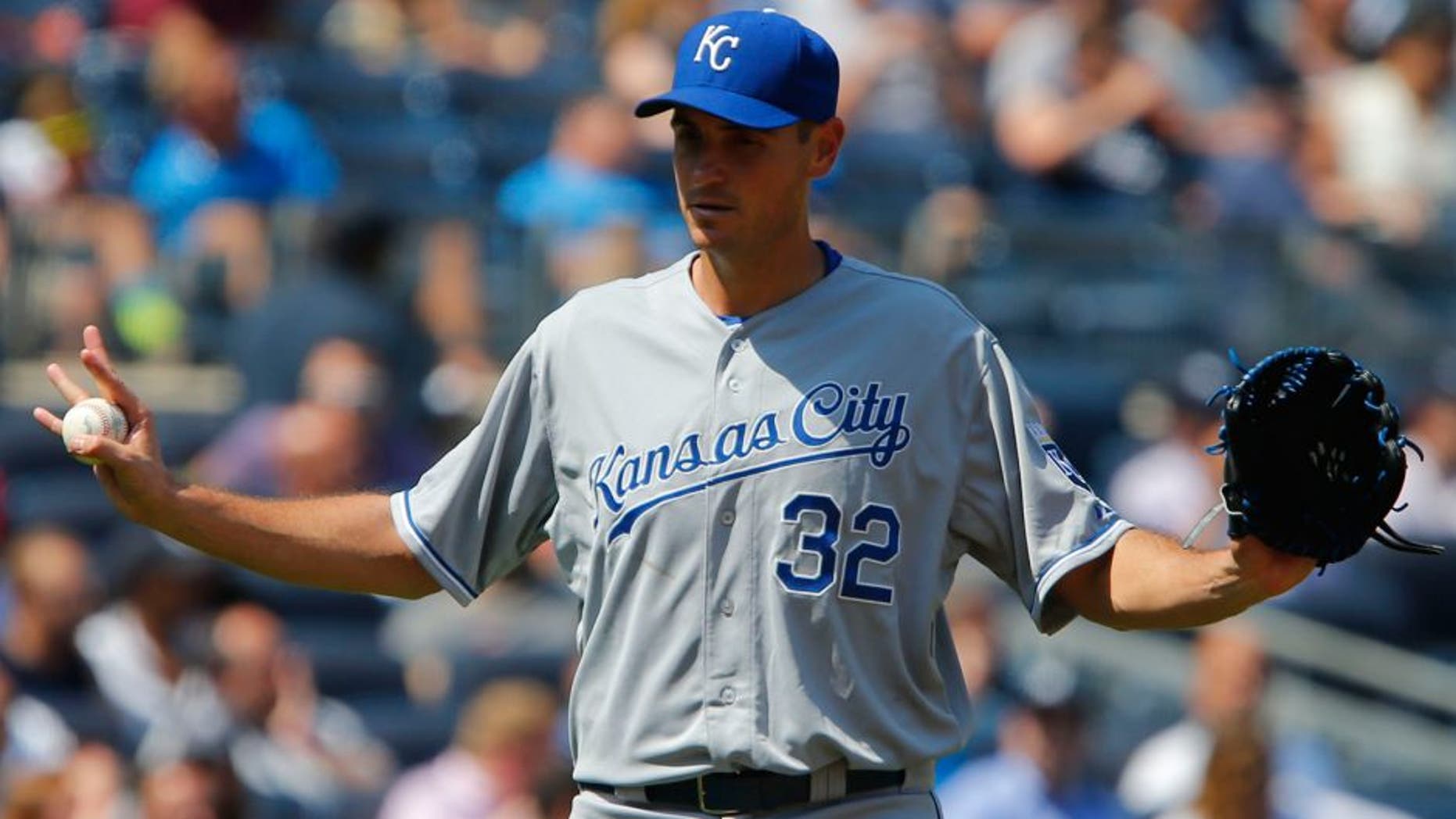 May 27, 2015; Bronx, NY, USA; Kansas City Royals pitcher Chris Young (32) reacts after giving up hits to New York Yankees right fielder Chris Young (not pictured) and center fielder Slade Heathcott (not pictured) in the sixth inning at Yankee Stadium. Mandatory Credit: Noah K. Murray-USA TODAY Sports