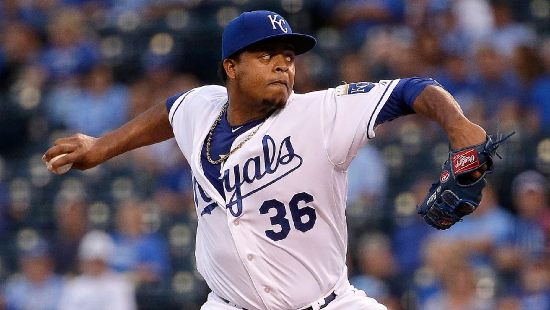 Kansas City Royals starting pitcher Edinson Volquez throws during the first inning of a baseball game against the Minnesota Twins Tuesday, Sept. 8, 2015, in Kansas City, Mo. (AP Photo/Charlie Riedel)