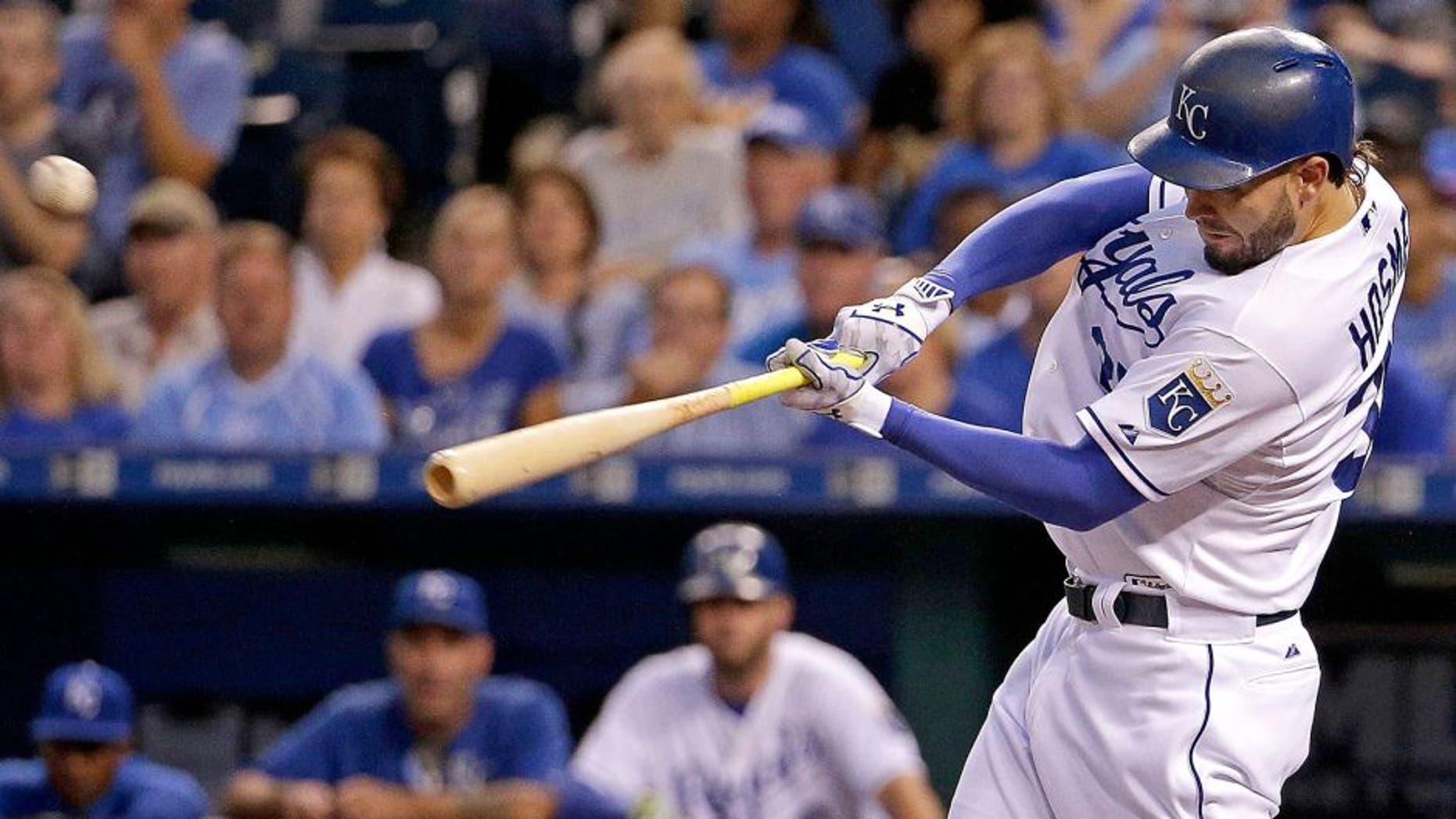Kansas City Royals' Eric Hosmer hits a three-run double during the first inning of a baseball game against the Minnesota Twins Tuesday, Sept. 8, 2015, in Kansas City, Mo. (AP Photo/Charlie Riedel)