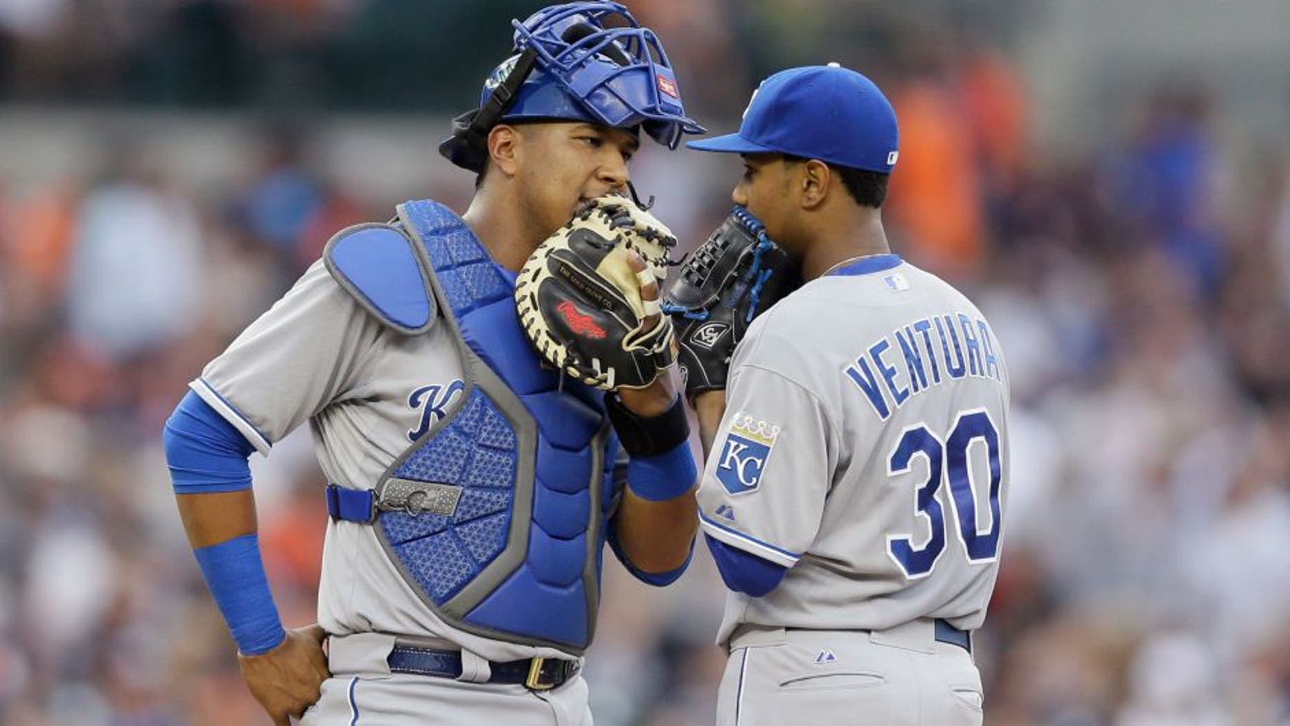 Kansas City Royals catcher Salvador Perez, left, talks with starting pitcher Yordano Ventura during the second inning of a baseball game against the Detroit Tigers, Friday, May 8, 2015, in Detroit. (AP Photo/Carlos Osorio)