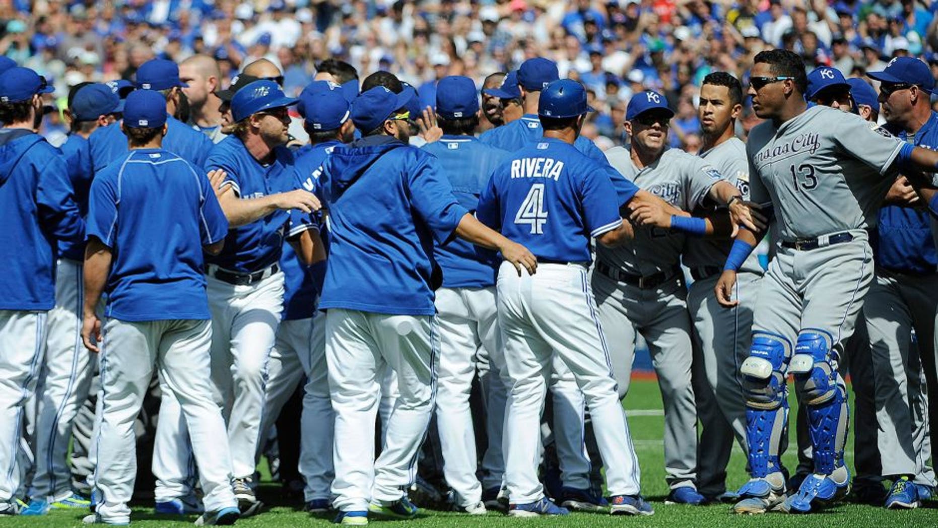 Aug 2, 2015; Toronto, Ontario, CAN; Toronto Blue Jays and Kansas City Royals players confrontation after relief pitcher Aaron Sanchez (41) pitches and hits Kansas City Royals short stop Alcides Escobar (2) (not in picture) and gets ejected by home plate umpire Jim Wolf in the eighth inning at Rogers Centre. Blue Jays beat Royals 5 - 2. Mandatory Credit: Peter Llewellyn-USA TODAY Sports