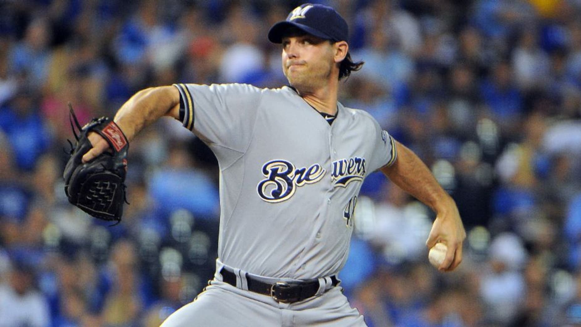Jun 17, 2015; Kansas City, MO, USA; Milwaukee Brewers relief pitcher Neal Cotts (48) delivers a pitch against the Kansas City Royals in the seventh inning at Kauffman Stadium. Kansas City won the game 10-2.