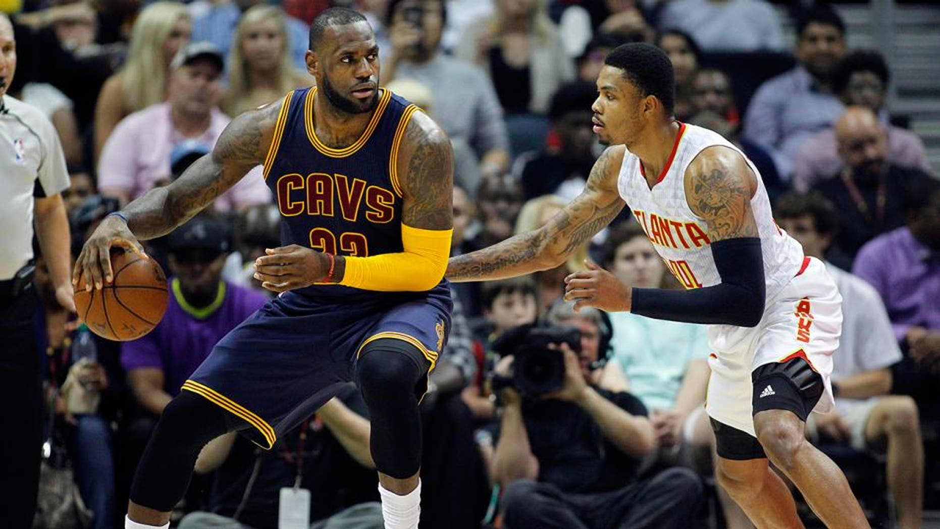 Apr 1, 2016; Atlanta, GA, USA; Cleveland Cavaliers forward LeBron James (23) is defended by Atlanta Hawks forward Kent Bazemore (24) in the first quarter at Philips Arena. Mandatory Credit: Brett Davis-USA TODAY Sports