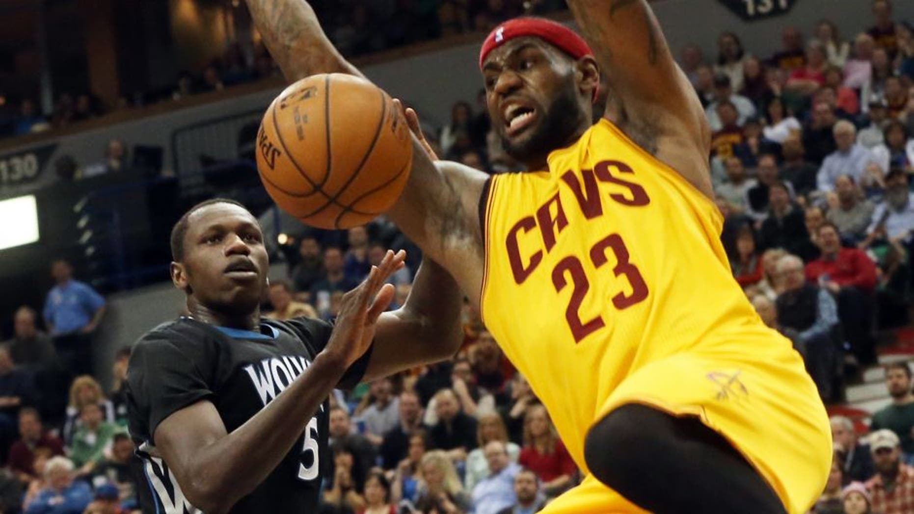 Cleveland Cavaliersâs LeBron James, right, dunks in front of Minnesota Timberwolvesâ Gorgui Dieng of Senegal in the second half of an NBA basketball game, Saturday, Jan. 31, 2015, in Minneapolis. The Cavaliers won 106-90. James led the Cavaliers with 36 points. (AP Photo/Jim Mone),Cleveland Cavaliers's LeBron James, right, dunks in front of Minnesota Timberwolves' Gorgui Dieng of Senegal in the second half of an NBA basketball game, Saturday, Jan. 31, 2015, in Minneapolis. The Cavaliers won 106-90. James led the Cavaliers with 36 points. (AP Photo/Jim Mone)