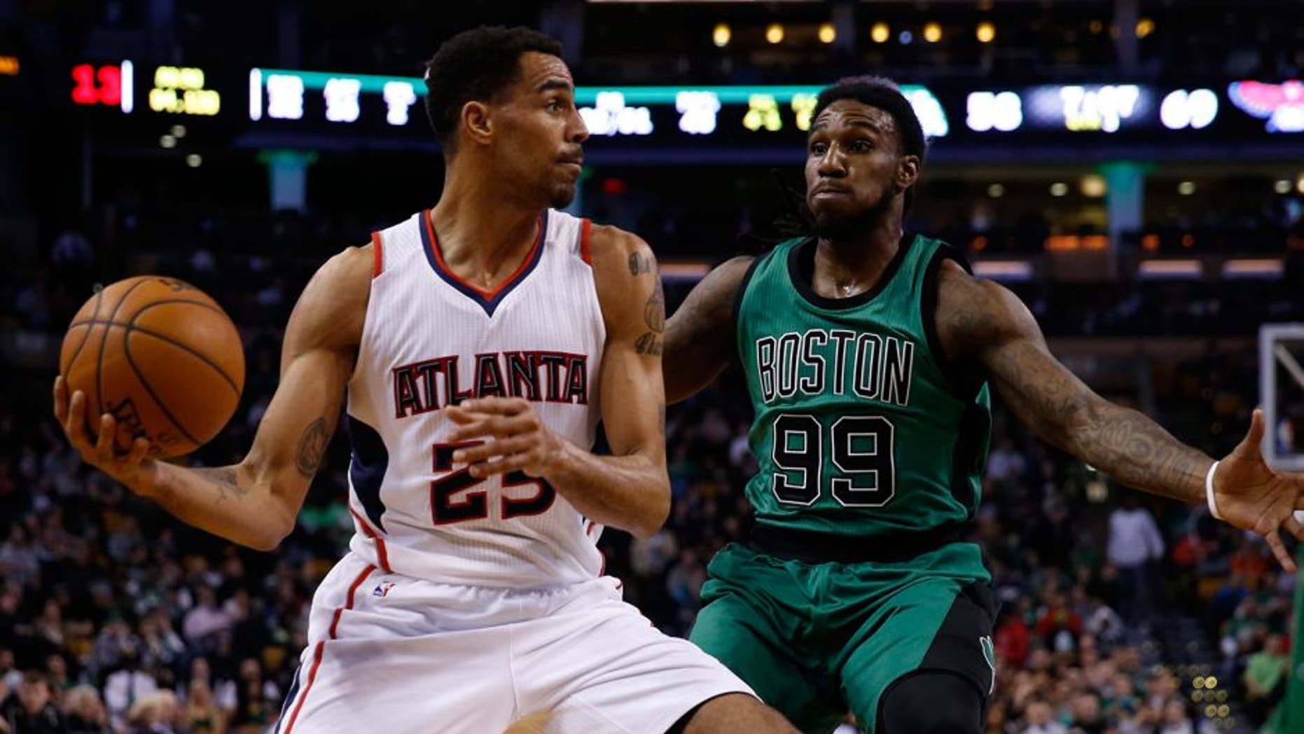Jan 14, 2015; Boston, MA, USA; Atlanta Hawks guard forward Thabo Sefolosha (25) makes a pass while guarded by Boston Celtics forward Jae Crowder (99) during the third quarter at TD Garden. Mandatory Credit: Greg M. Cooper-USA TODAY Sports