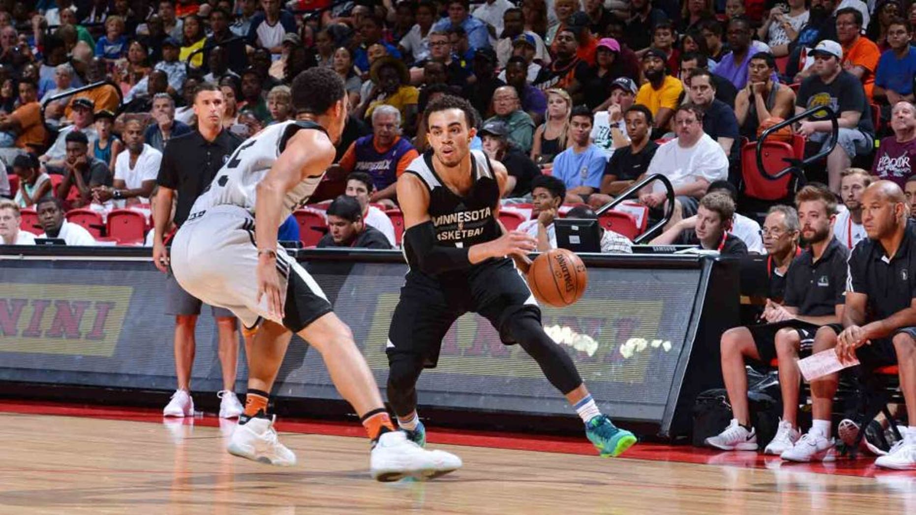 The Minnesota Timberwolves' Tyus Jones handles the ball against the Phoenix Suns during a 2016 NBA Las Vegas Summer League tournament semifinal game July 17, 2016, at the Thomas & Mack Center in Las Vegas.