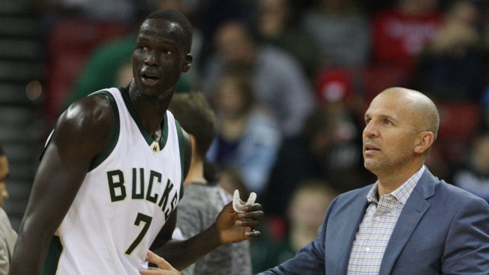 Milwaukee Bucks head coach Jason Kidd talks with Milwaukee Bucks forward Thon Maker during the game with the Dallas Mavericks.