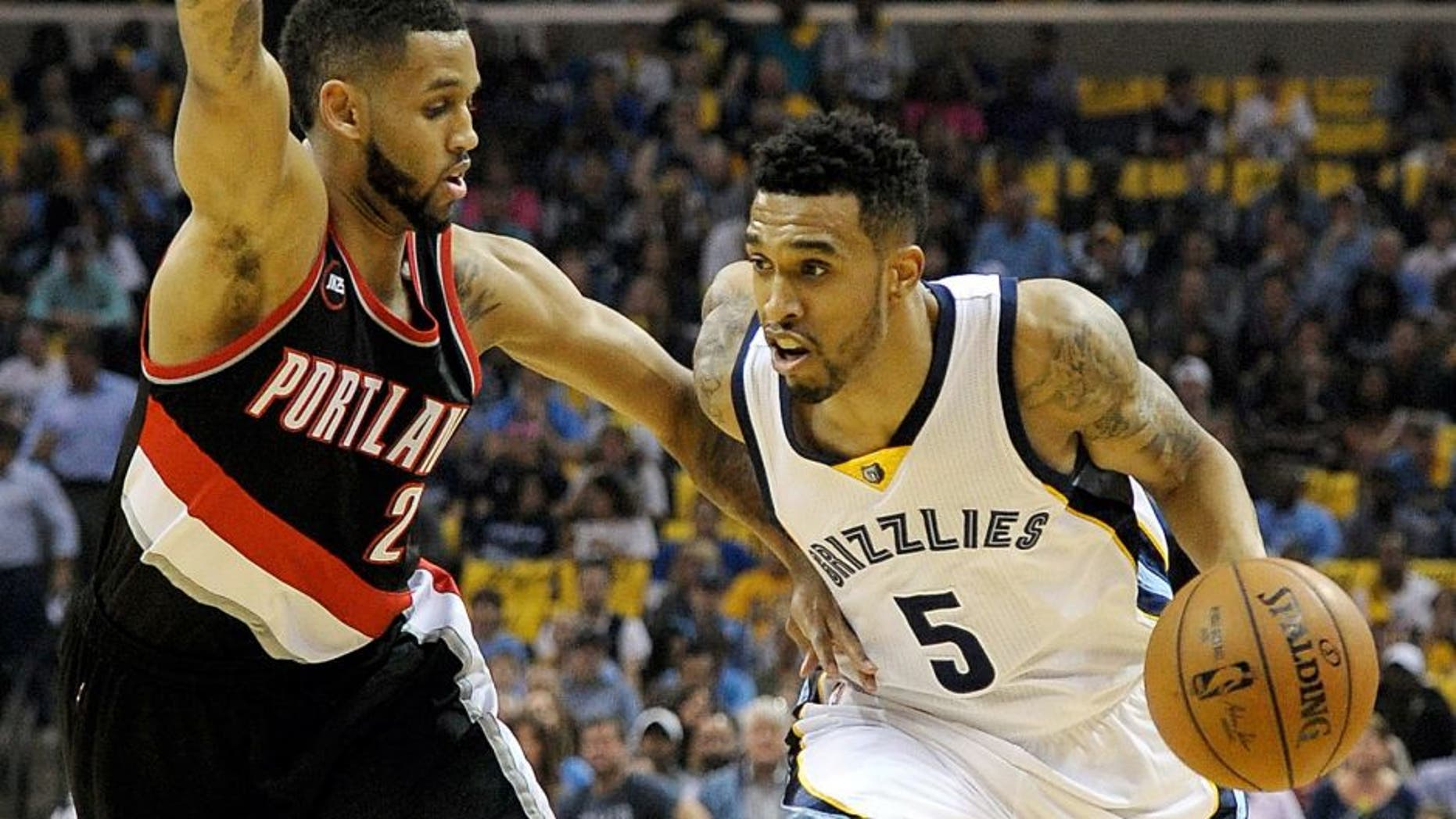 Apr 22, 2015; Memphis, TN, USA; Memphis Grizzlies guard Courtney Lee (5) drives to the basket against Portland Trail Blazers forward Allen Crabbe (23) in game two of the first round of the NBA Playoffs at FedExForum. Mandatory Credit: Justin Ford-USA TODAY Sports